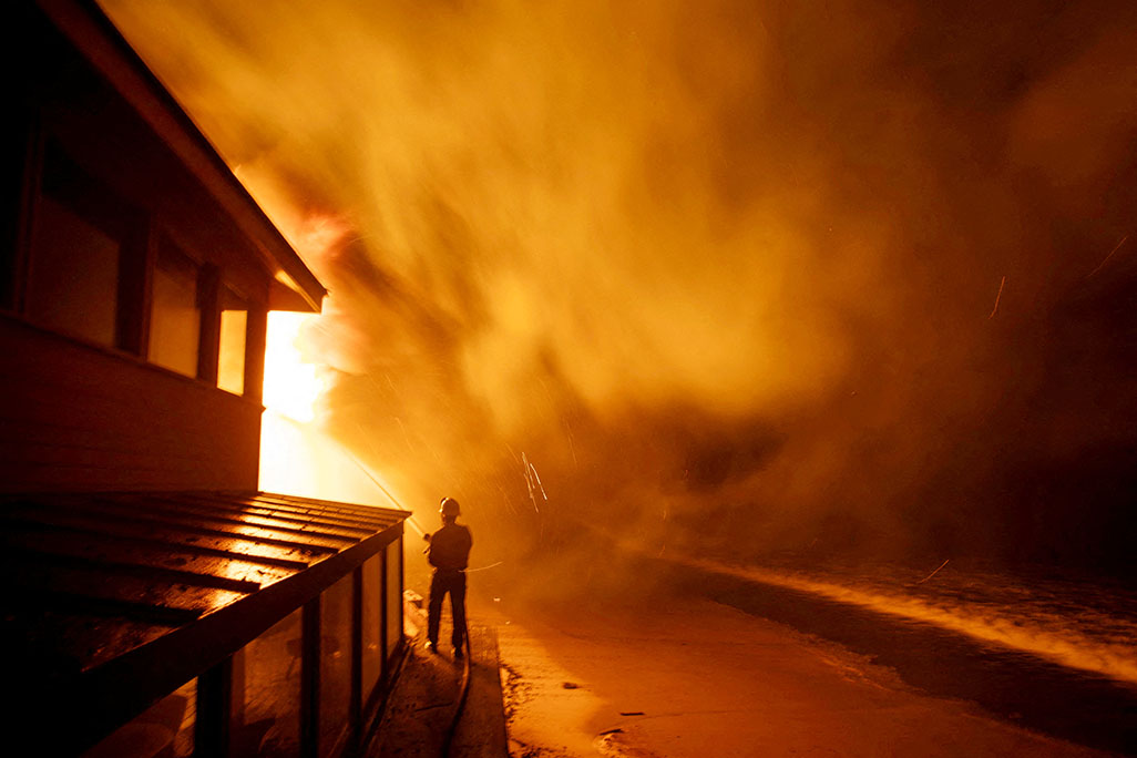 cover Massive Los Angeles fires rage on even as Hollywood blaze retreats