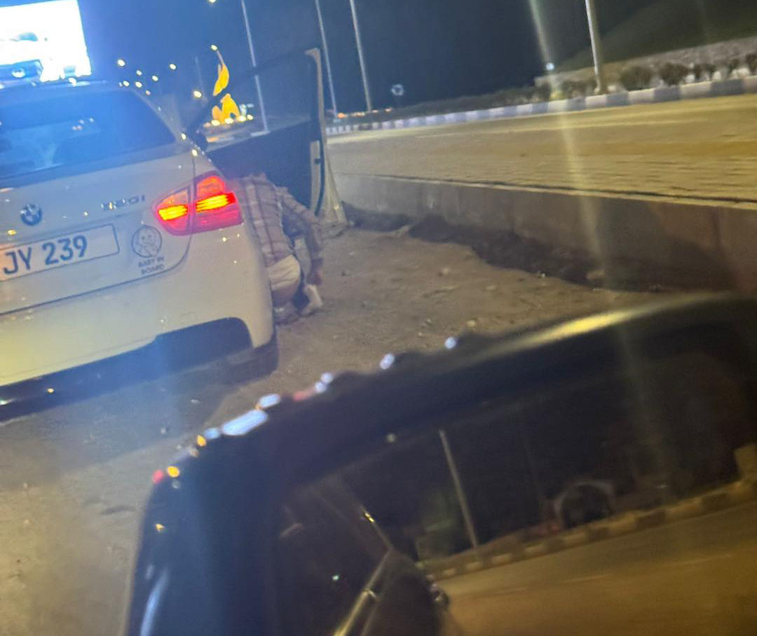 image Man stops car and defecates in middle of road