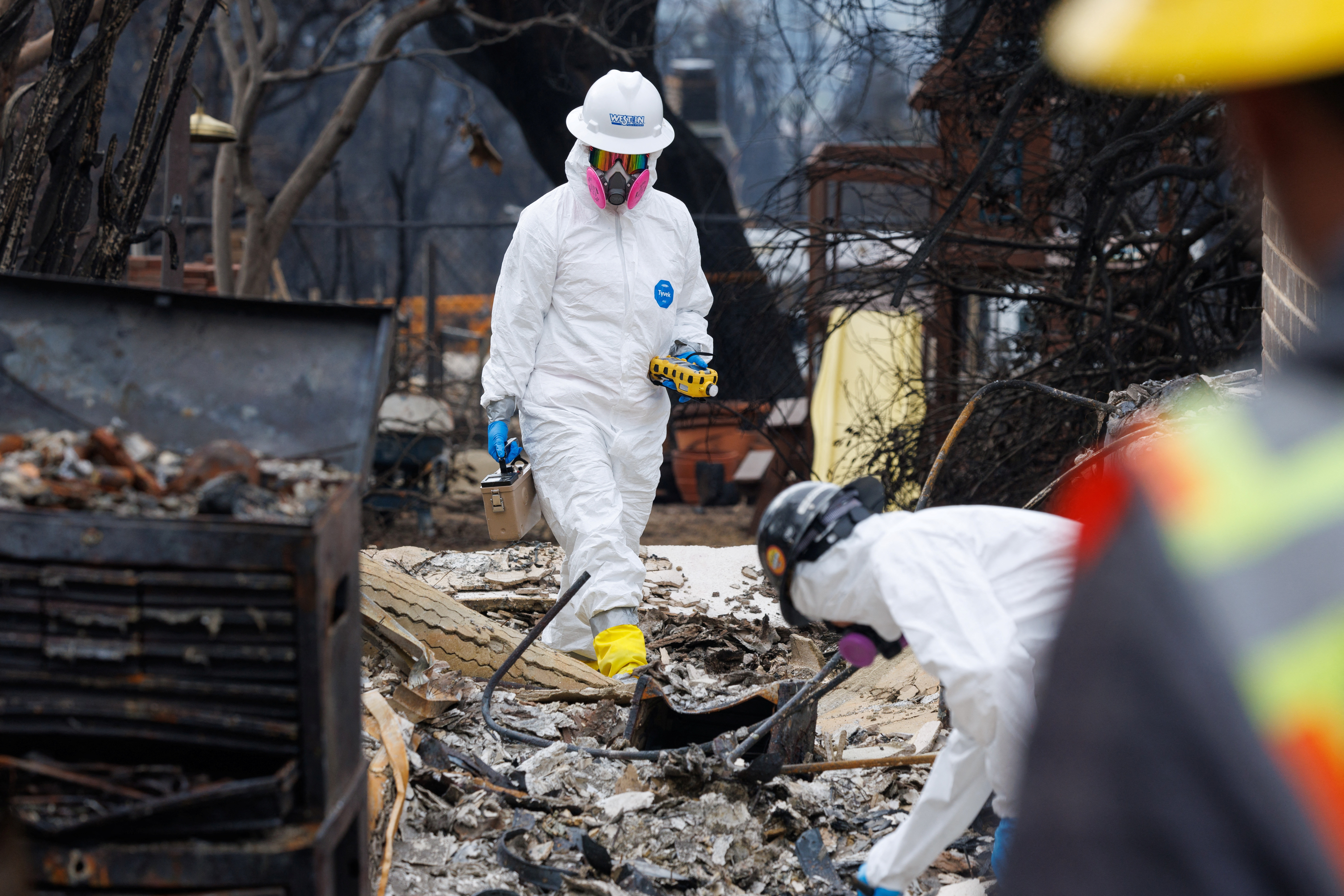 image Environmental workers race to clear toxic debris left by LA fires