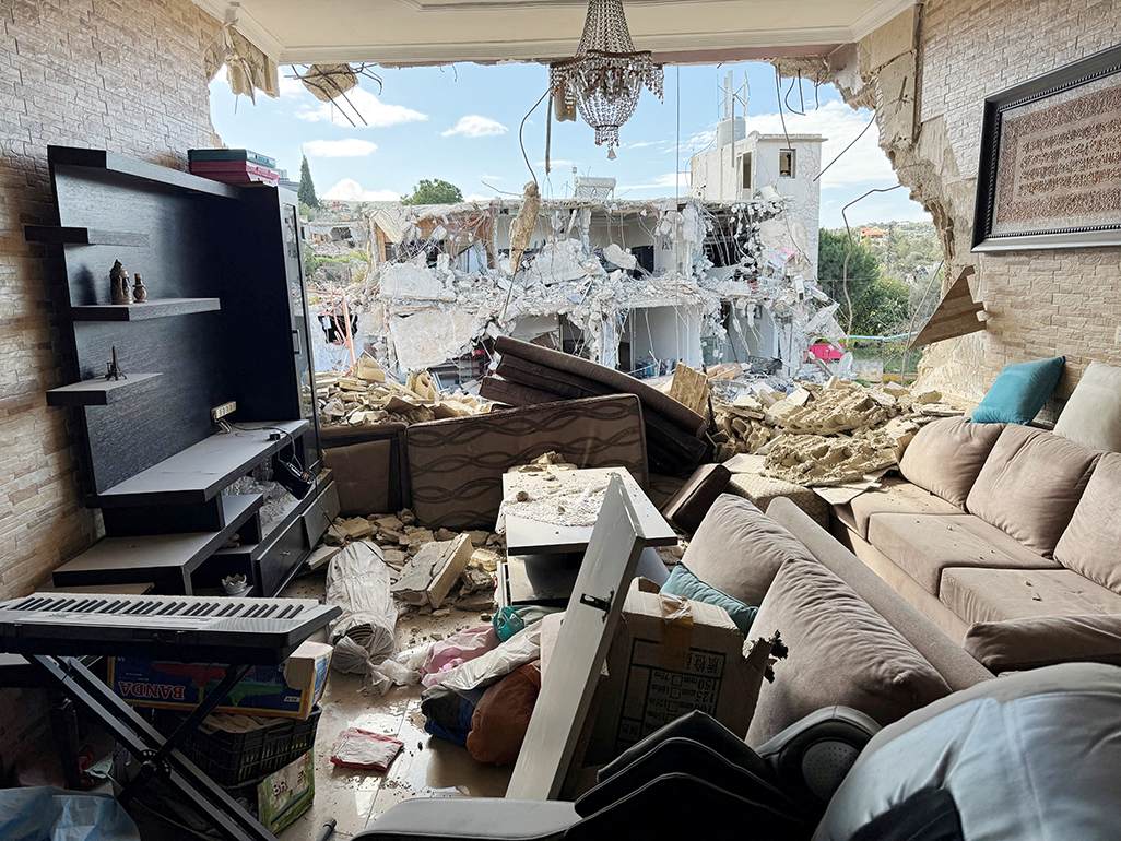 image Lebanese search for dead in devastated villages as Israel withdraws