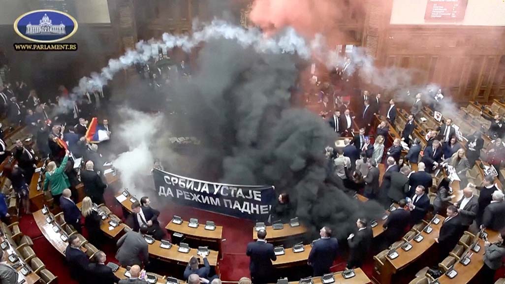 image Smoke grenades tossed in Serbian parliament, lawmaker suffers stroke