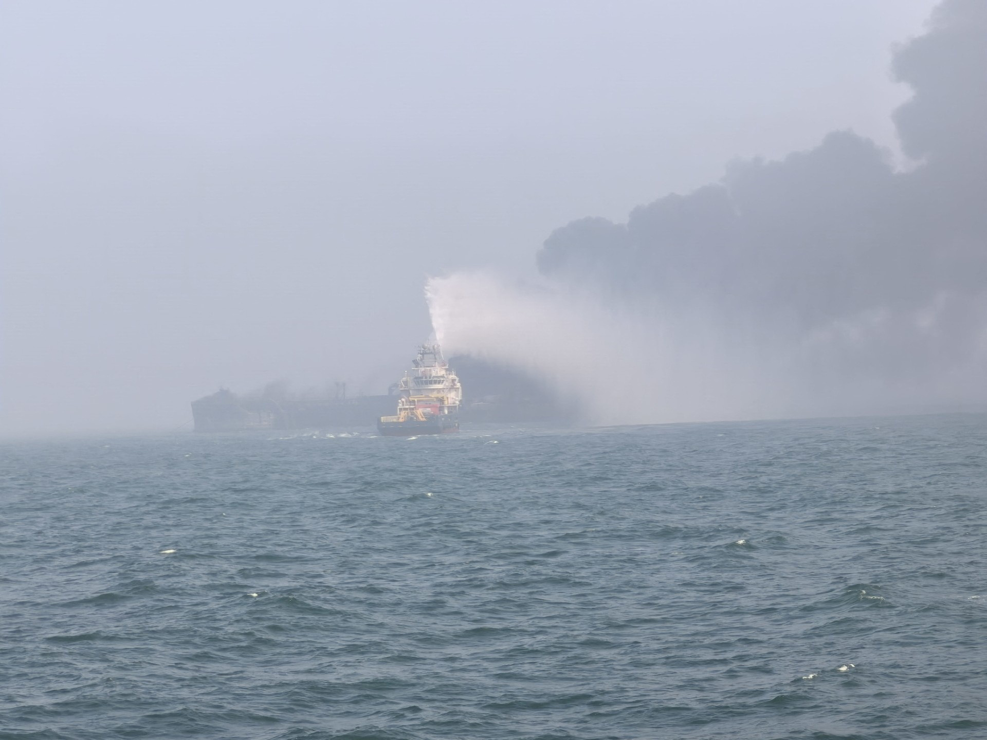 image Fires burn after ships collide off UK, stoking fears over environment