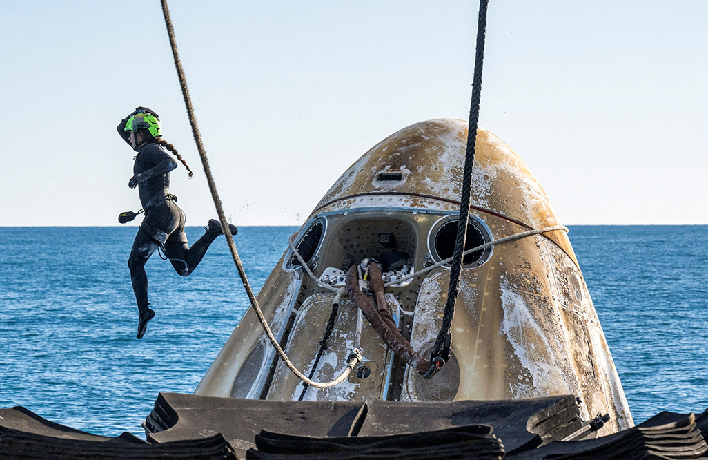 image NASA astronauts return to Earth after drawn-out mission in space