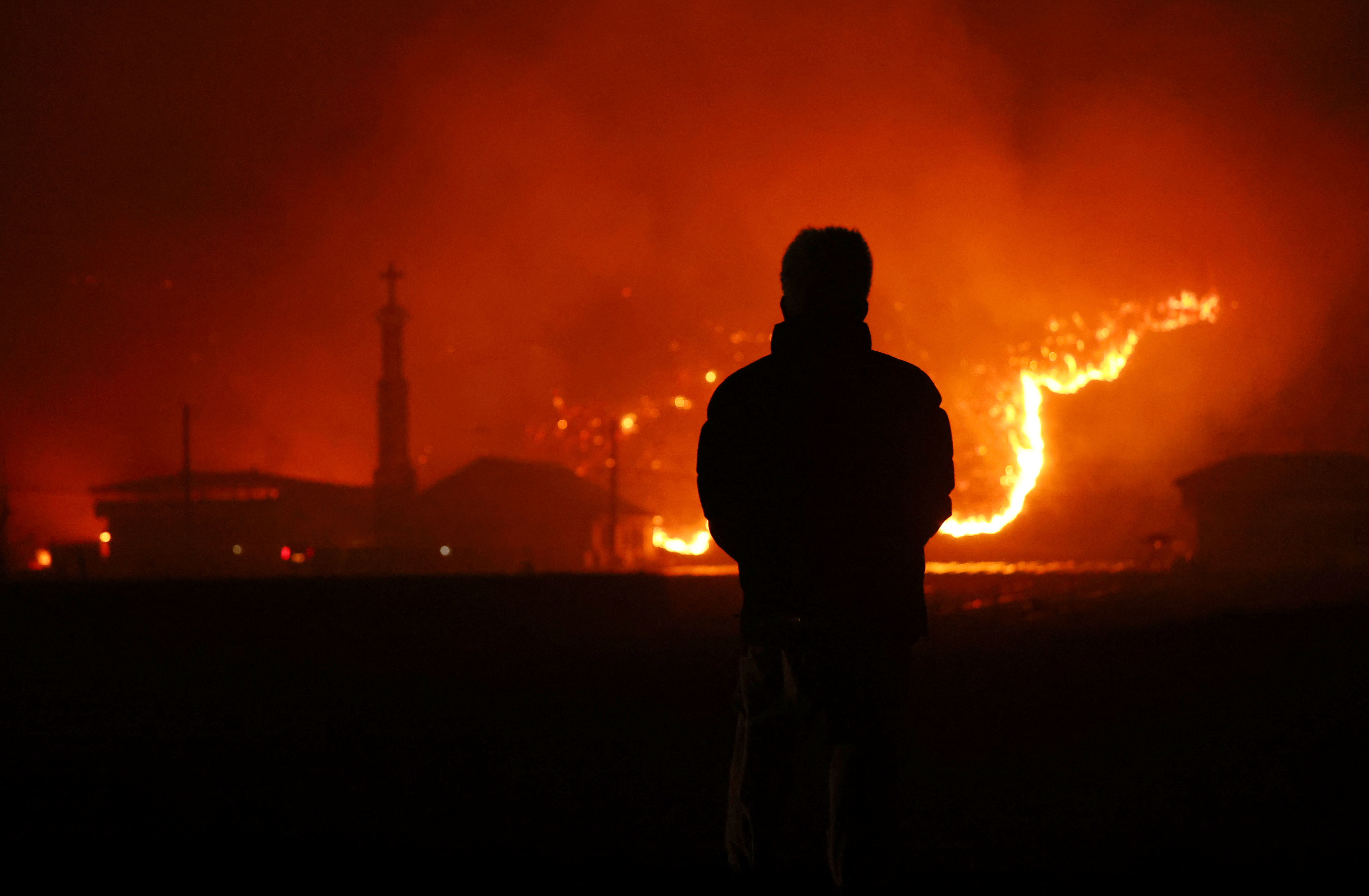 image Strong winds fan South Korea wildfires as death toll climbs to 18