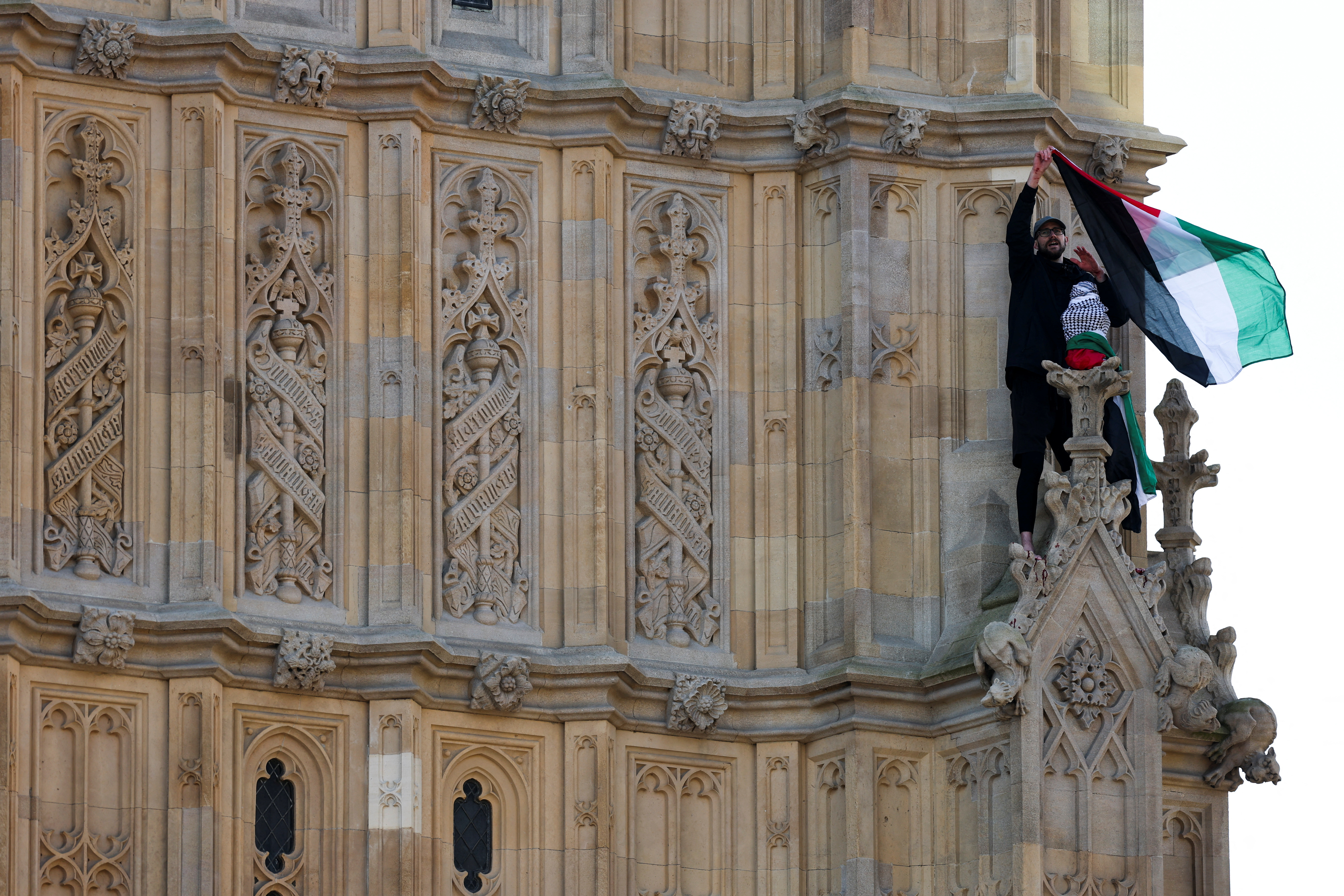 image Man climbs London&#8217;s Big Ben tower waving Palestinian flag