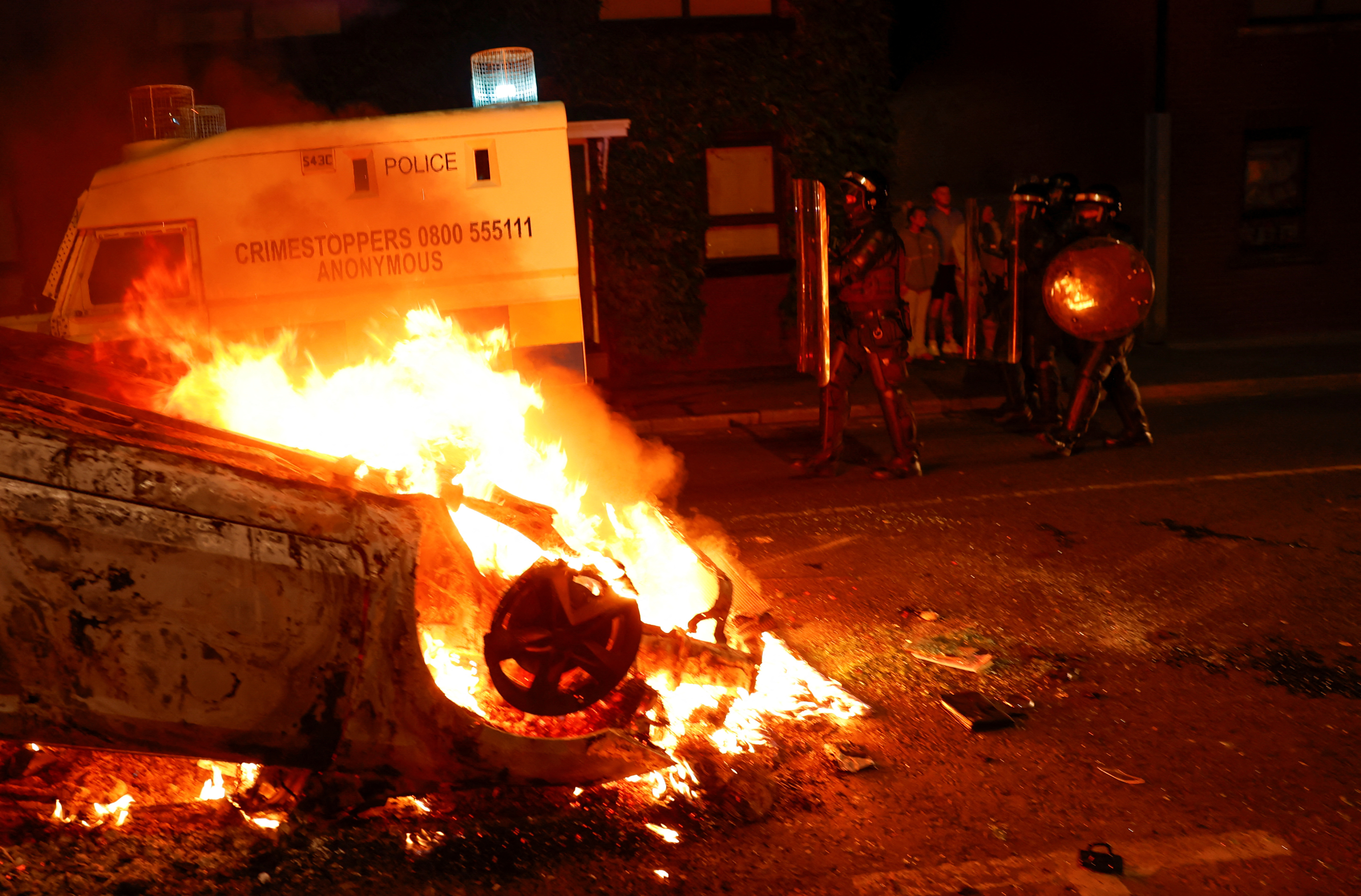 image Northern Irish rioters attack police, torch houses for second night