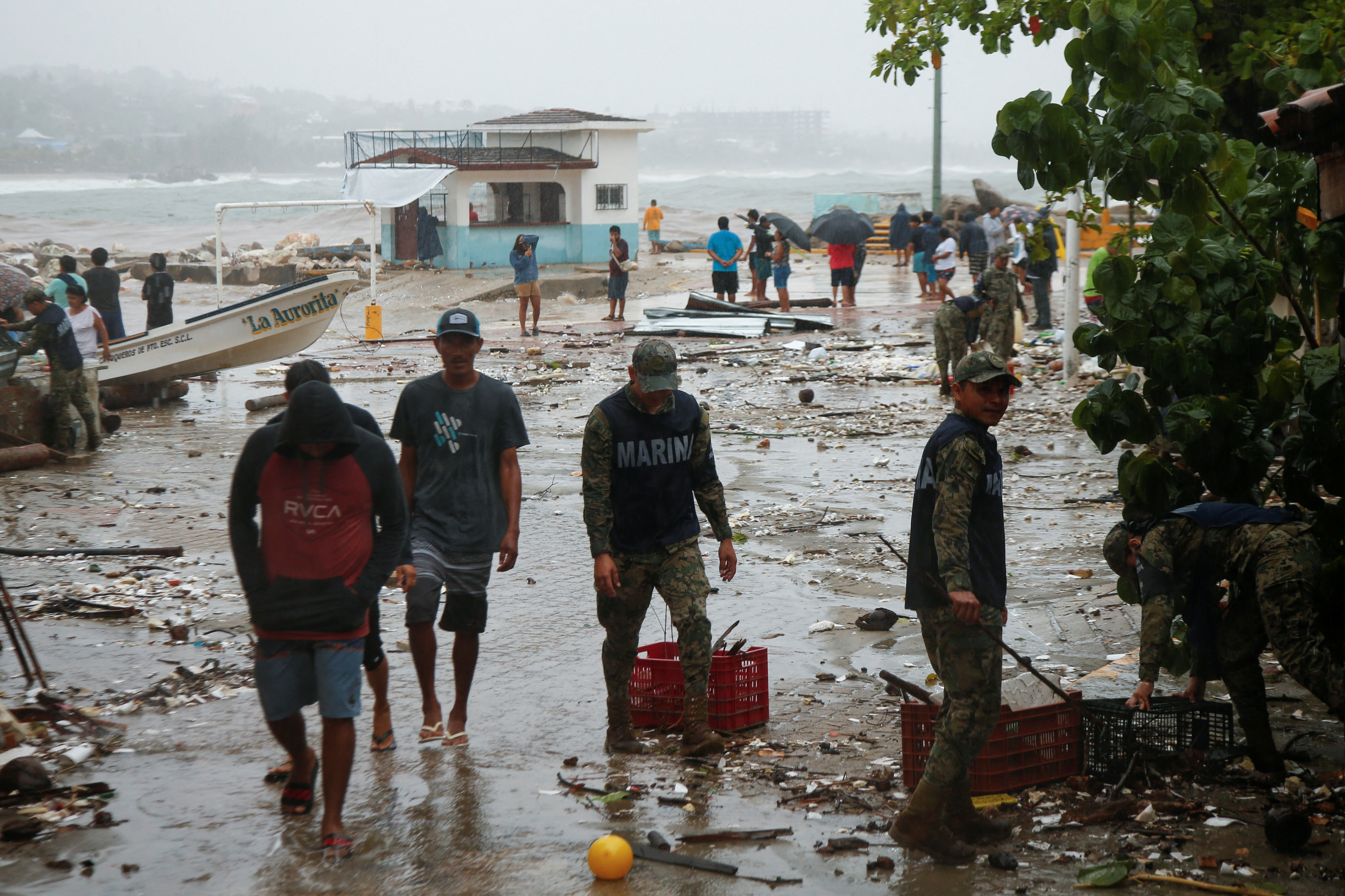 cover Hurricane Erick weakens over Mexico, leaving trail of damage in its wake