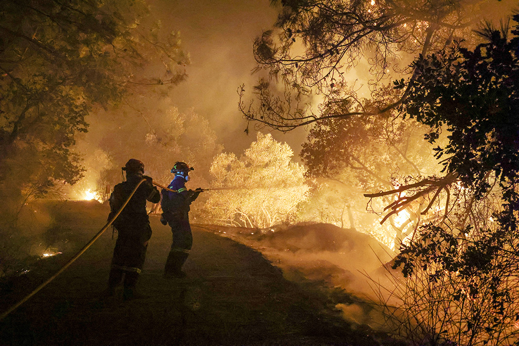 cover Greece holds Georgian suspected of fuelling Chios fire with cigarette