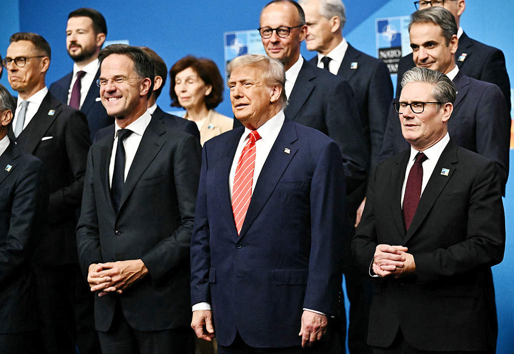 cover Nato commits to higher spending sought by Trump and mutual defence