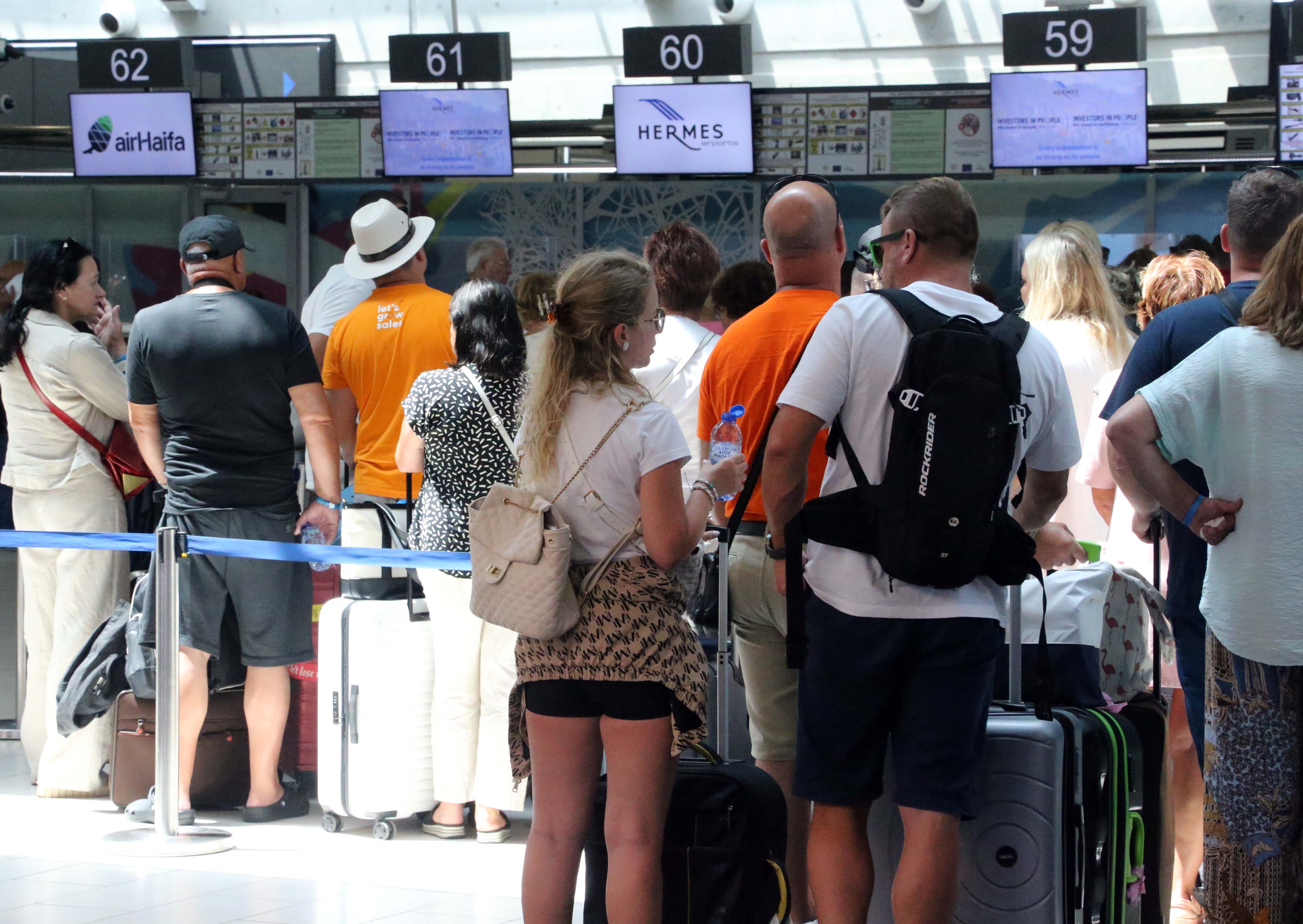 cover Airport passengers urged to arrive three hours early