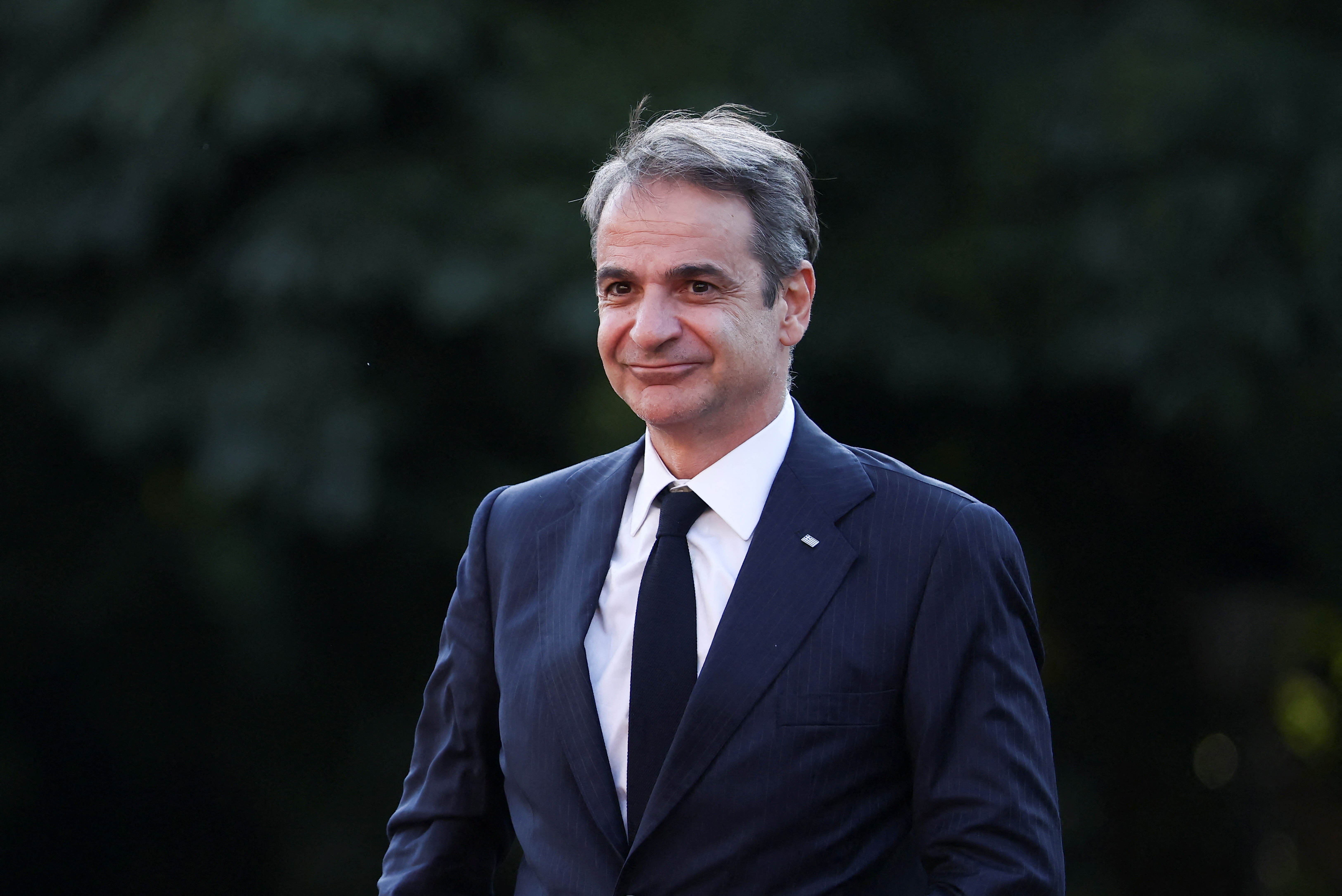 cover Mitsotakis says all NATO members should commit to defence spending target