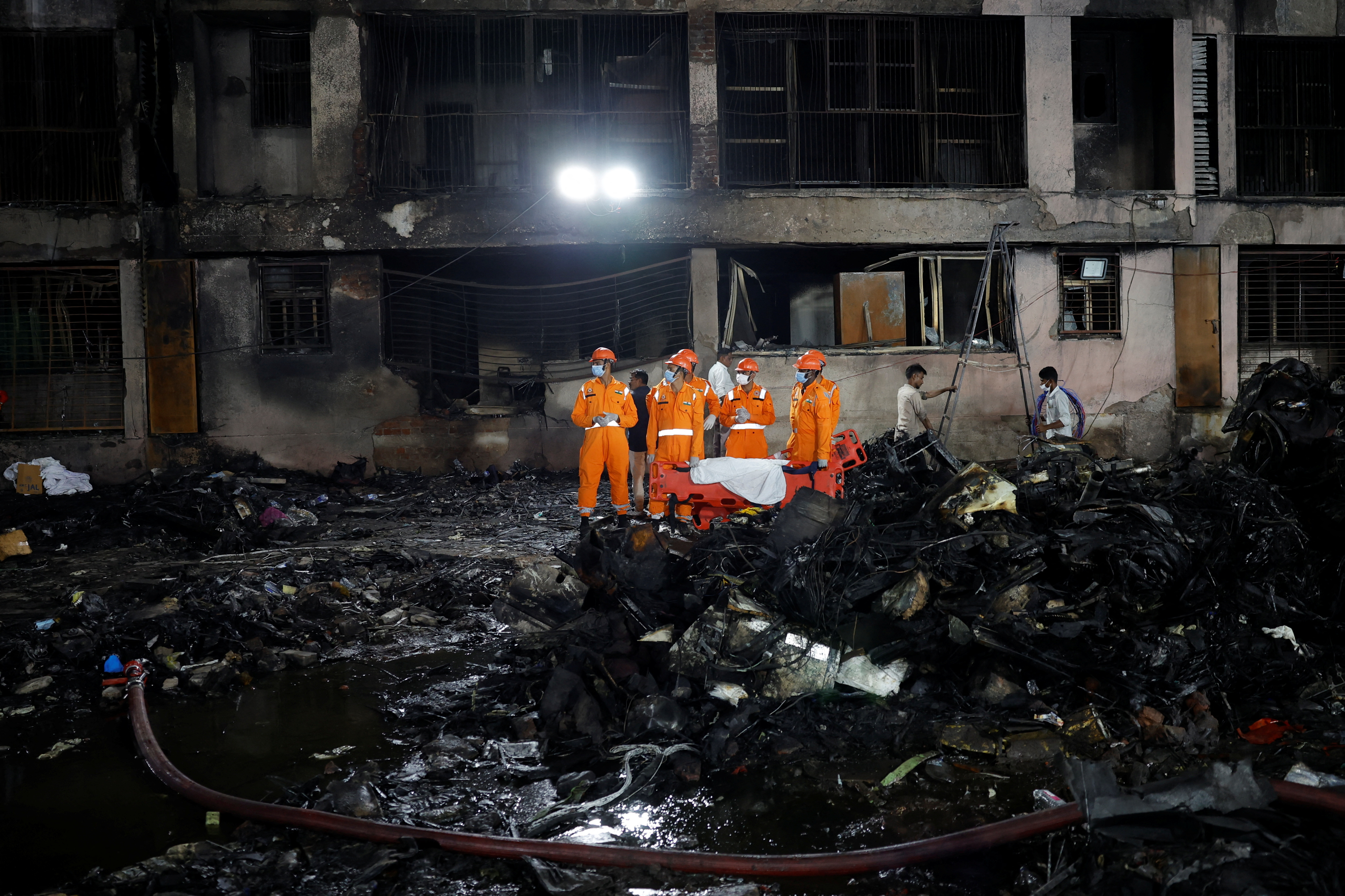 image Rescuers search for missing people, aircraft parts after Air India crash kills over 240