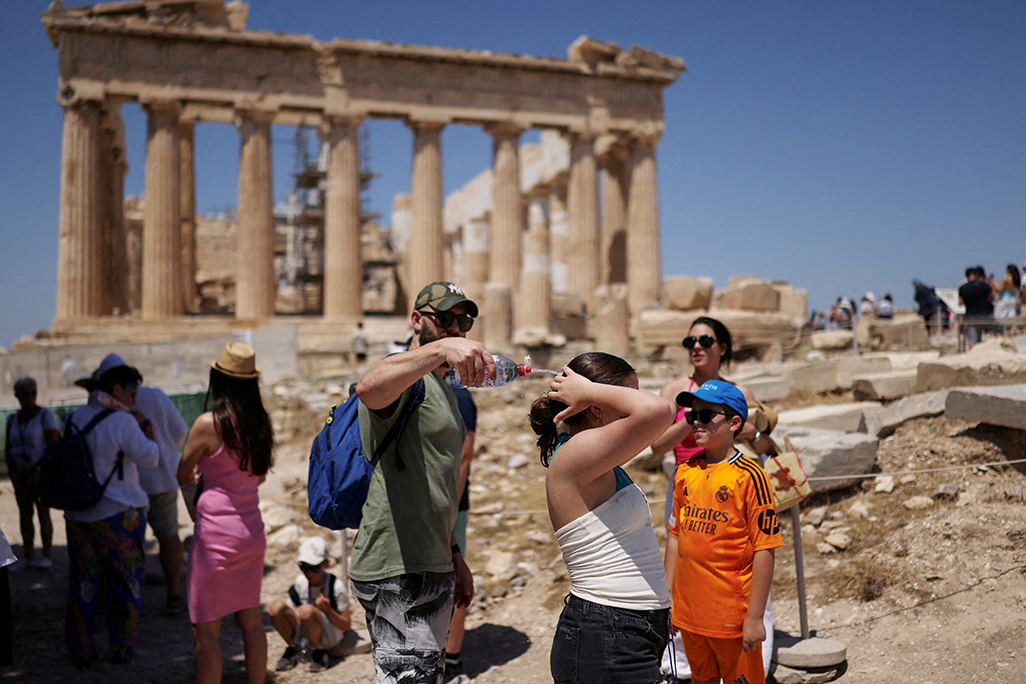 cover Tourists and labourers seek respite as Greece and Balkans gripped by heatwave