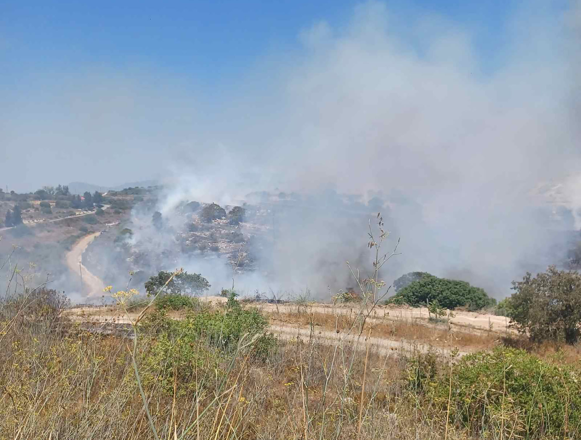 cover Arodes wildfire contained, residents told to stay alert