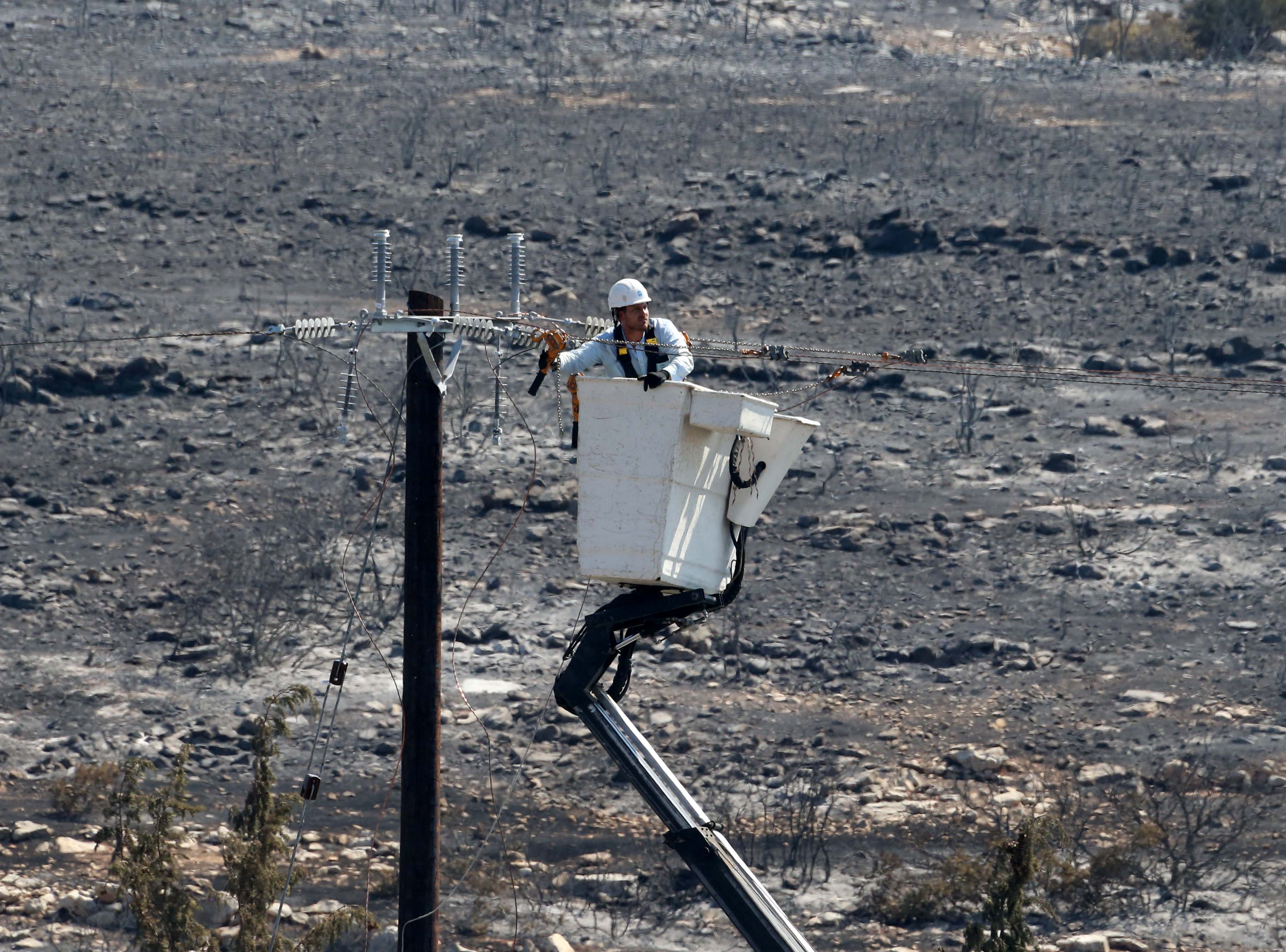 cover Team of 150 people working to fix power lines damaged by Limassol fire