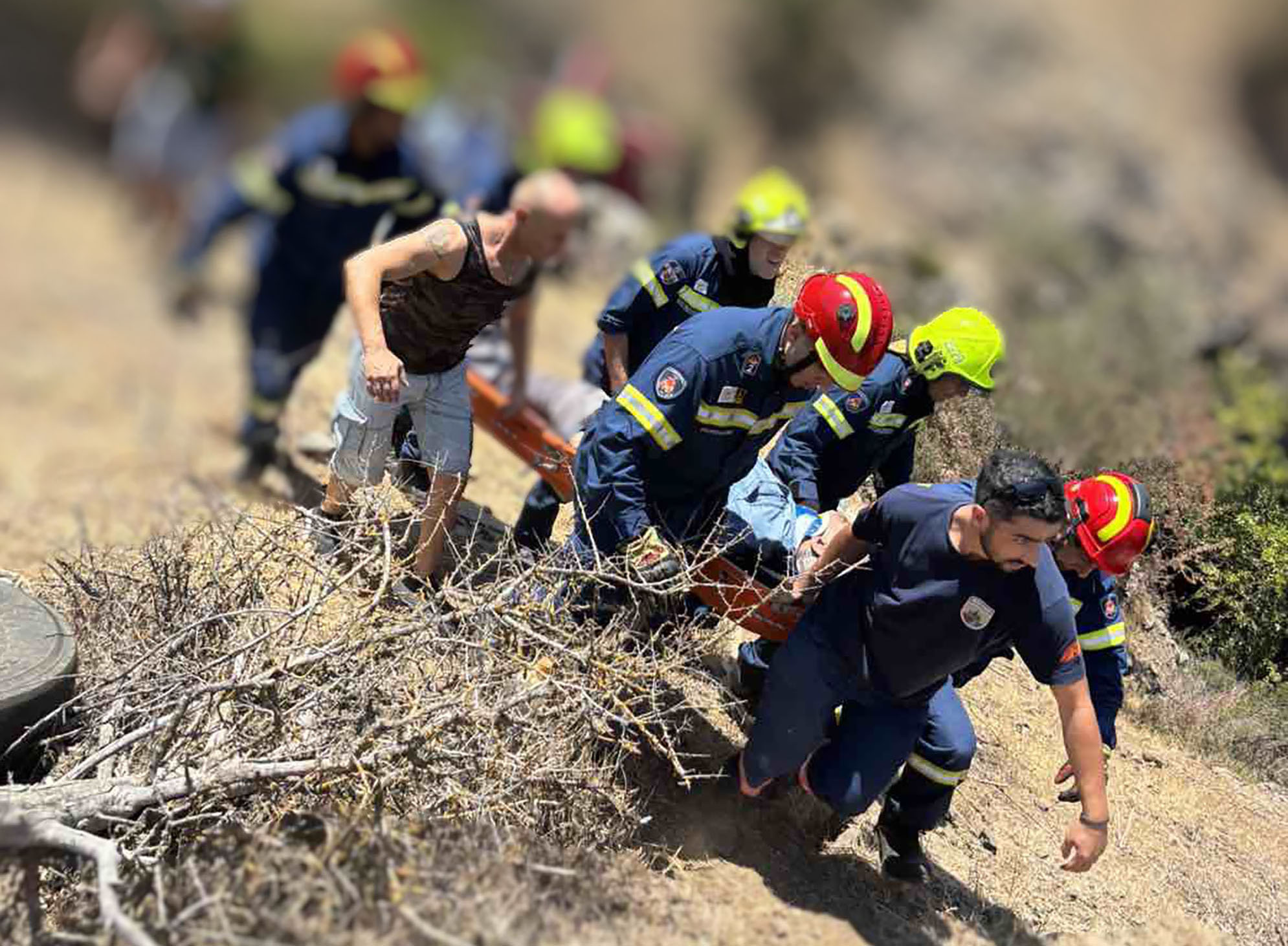 cover Firemen rescue driver from 10m fall