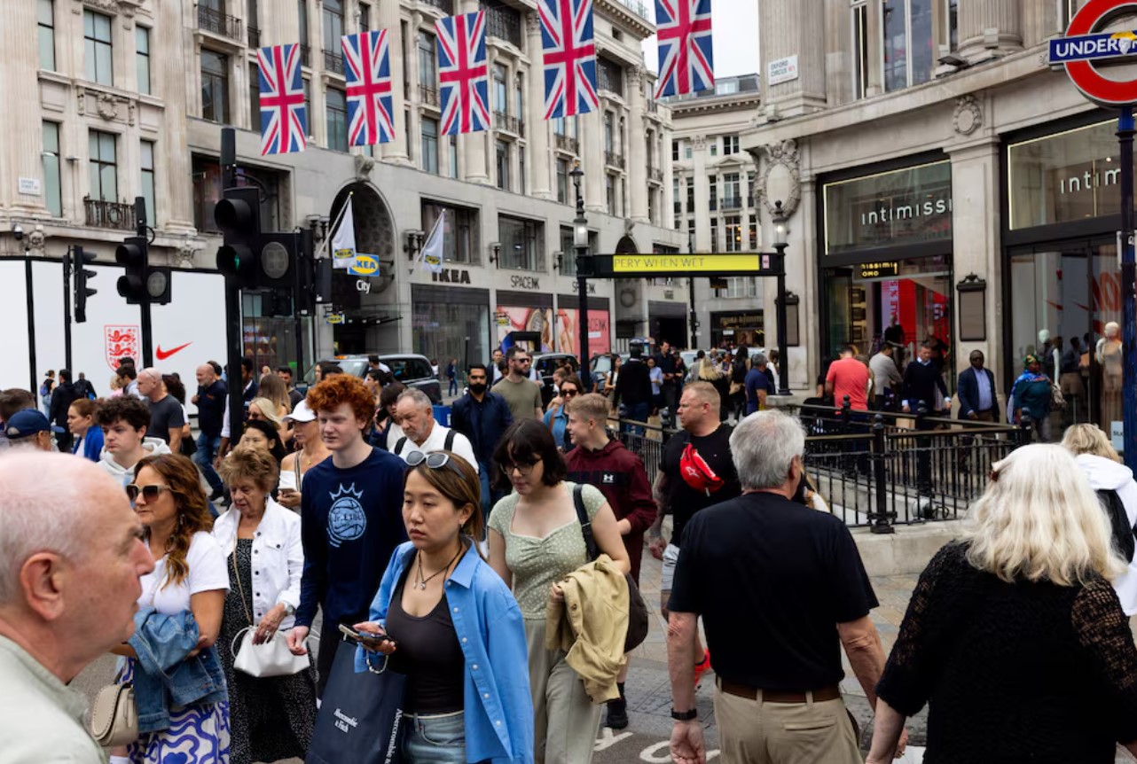 cover UK spending rises in July on warm weather and higher food prices