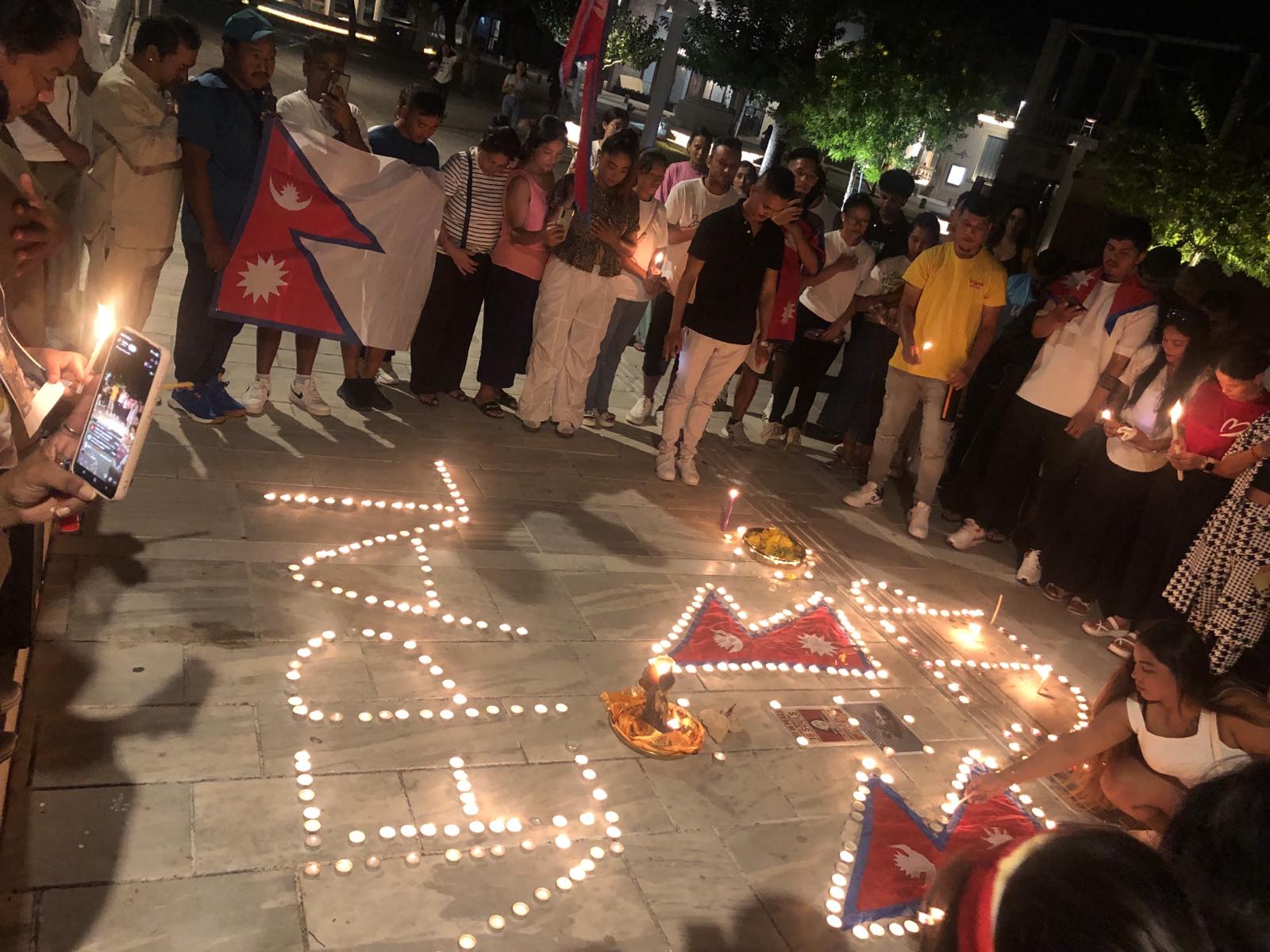 cover Paphos Nepalese gather to honour protest victims in Nepal