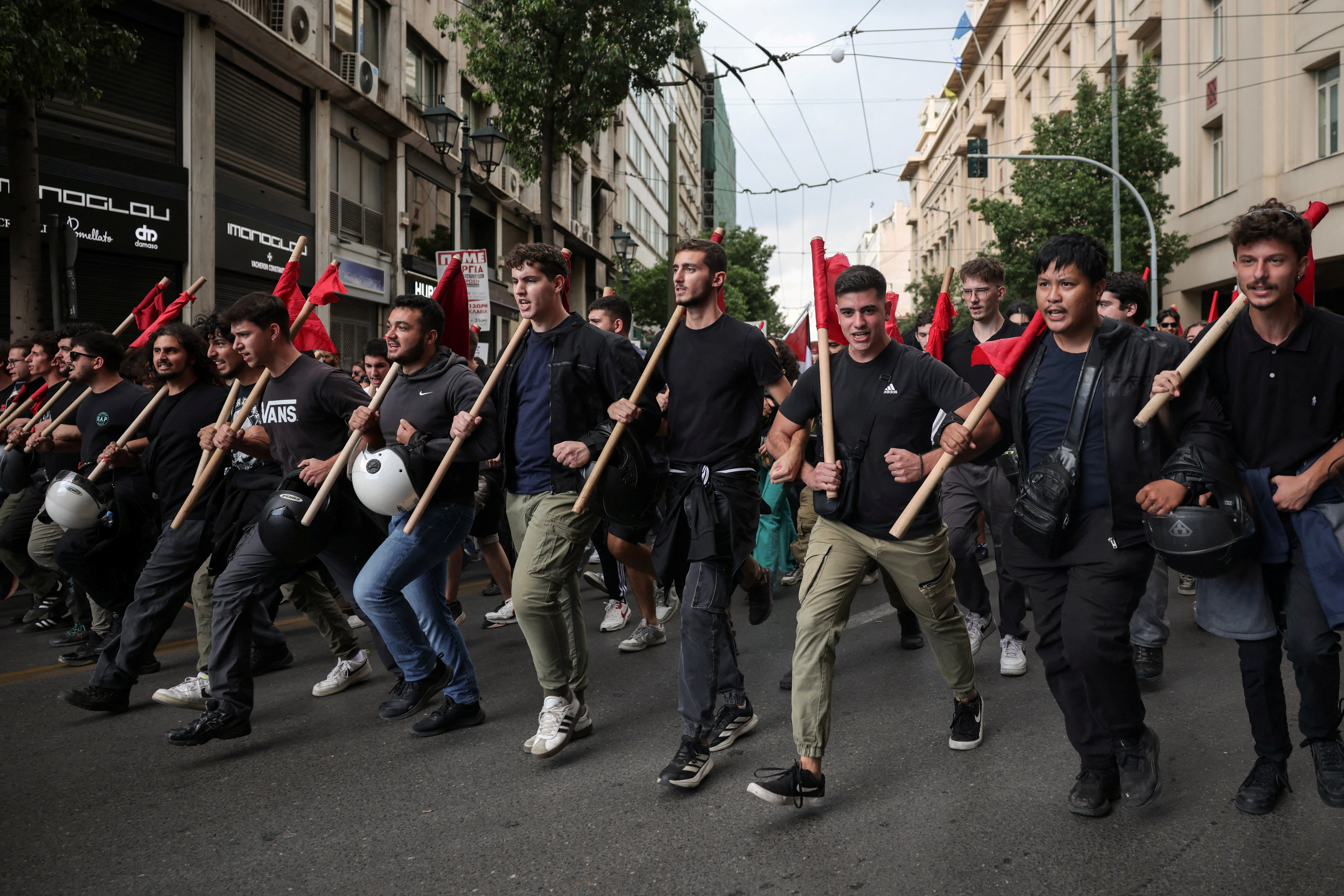 image Greek ferries and trains halted as thousands protest over working hours
