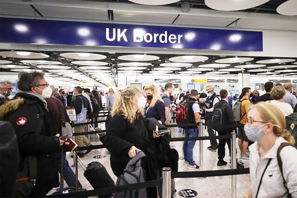 cover Net immigration to Britain revised down as more Britons emigrate