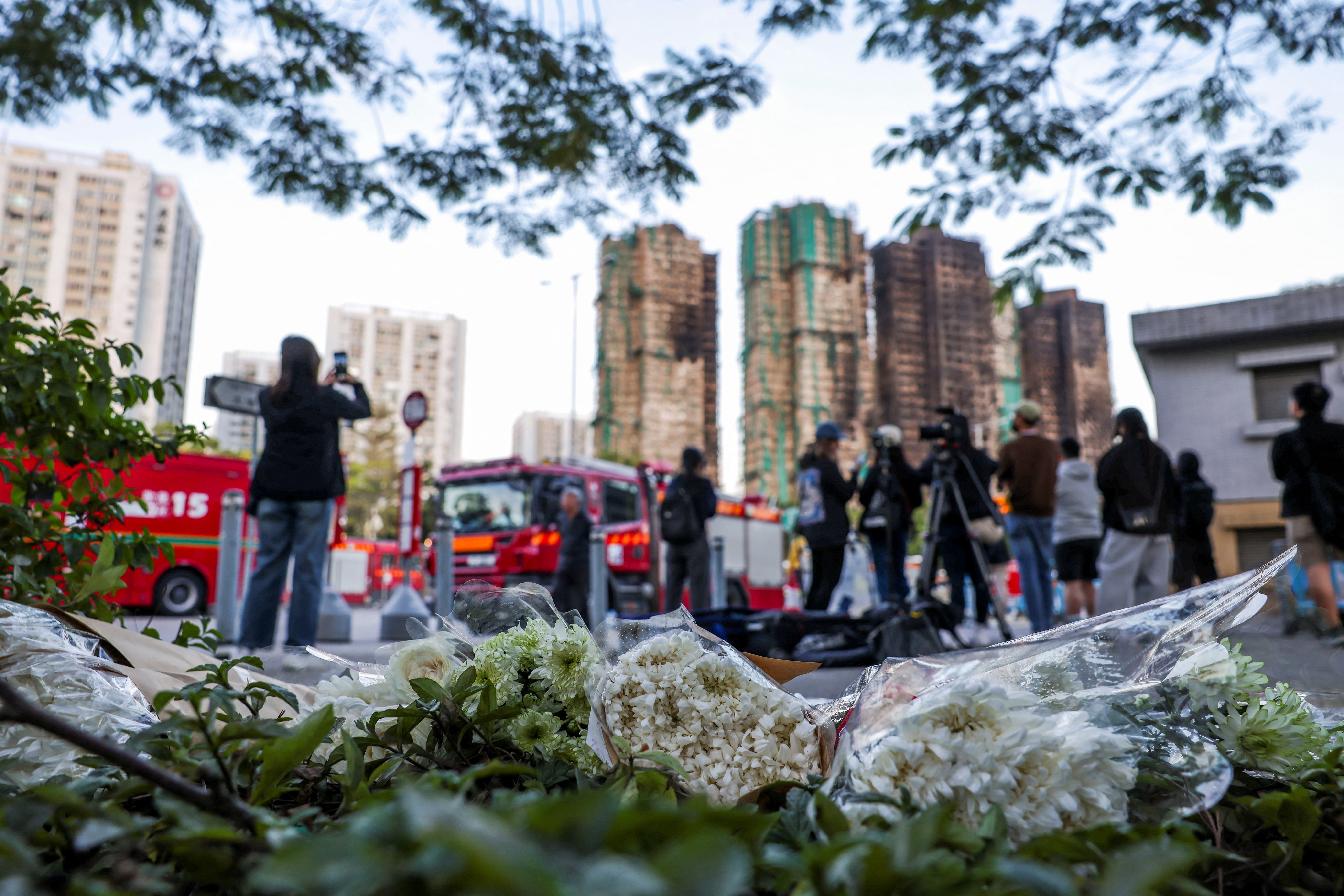 cover Hong Kong tower fire toll rises to 128, while 200 remain missing