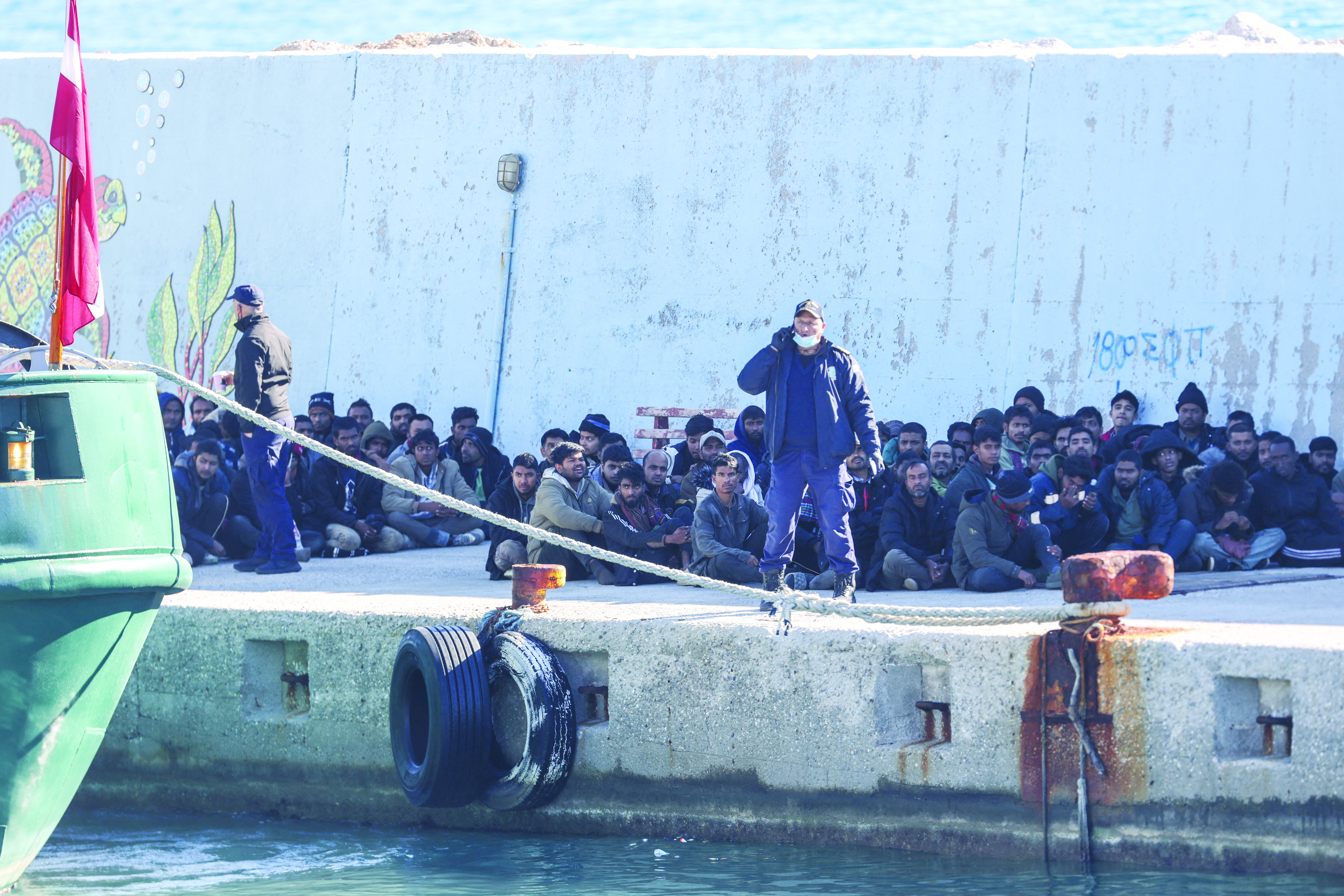 cover Hundreds of migrants land in Greece after search operation at sea