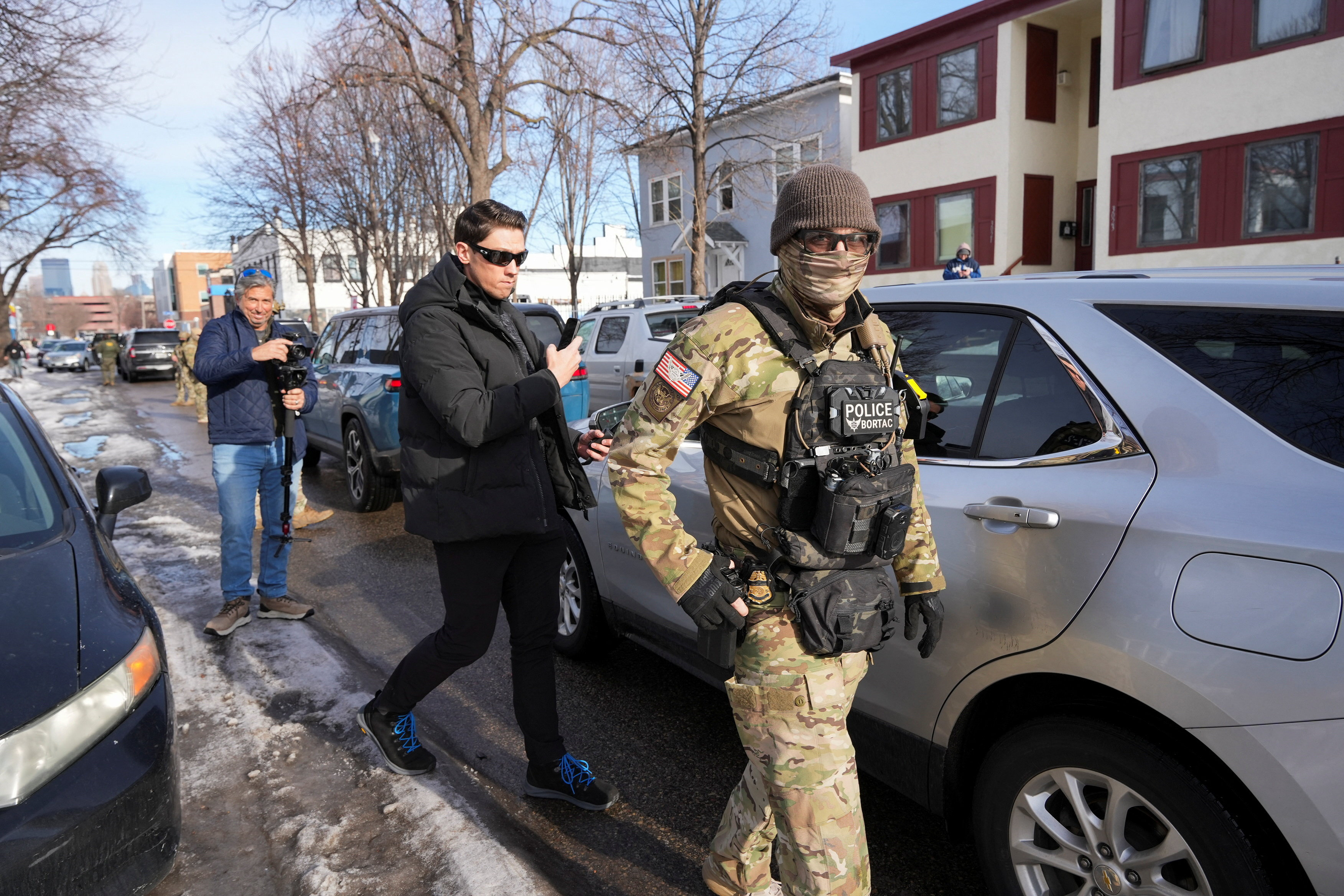 cover Minnesota officials open their own probe of ICE shooting as protests spread