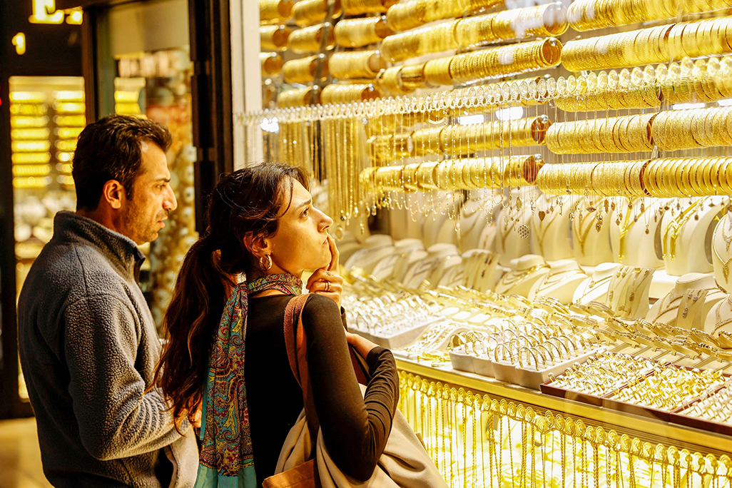 image Gold races to $5,100 record peak on frantic safe-haven demand
