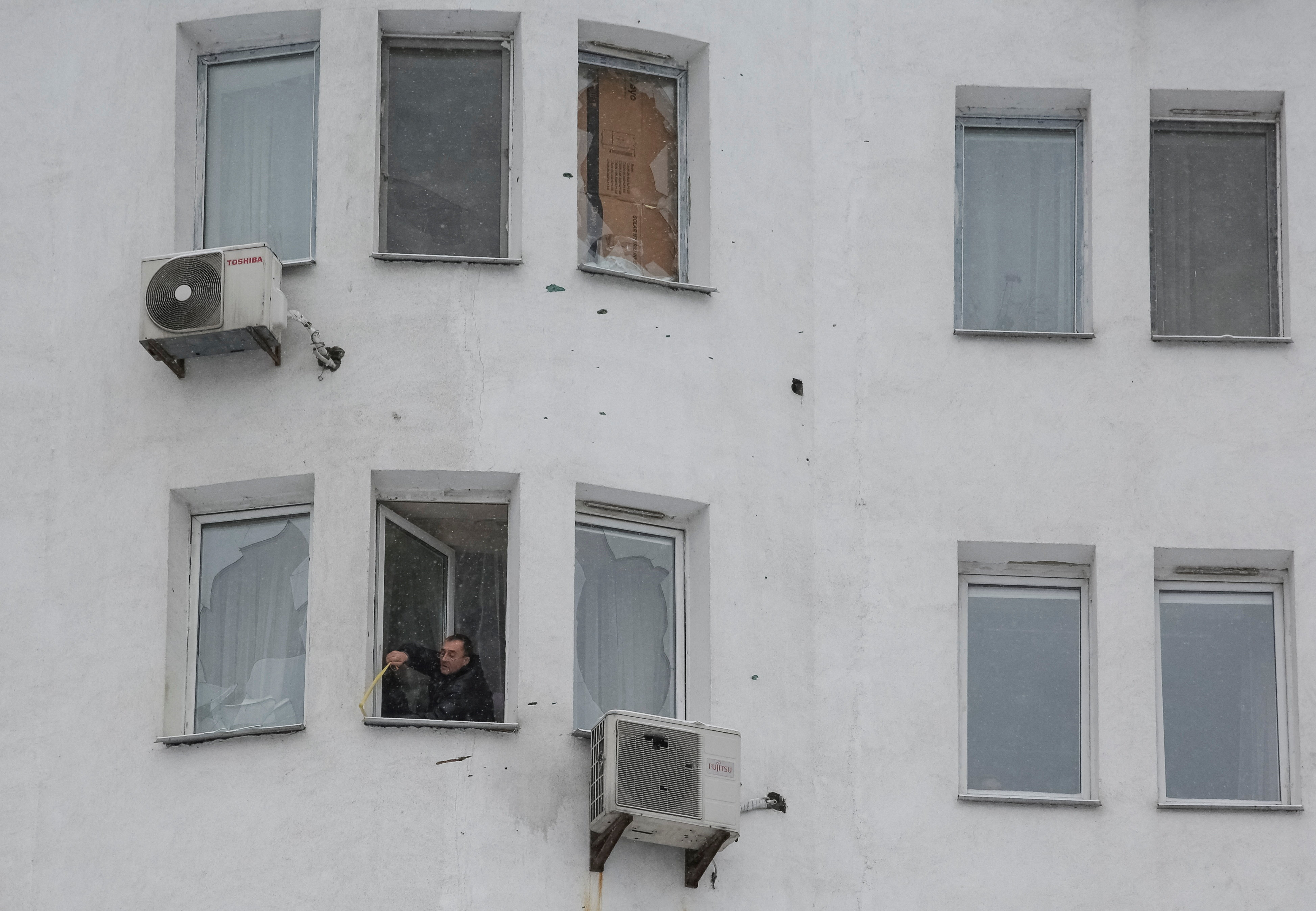 cover Kyiv scrambles to repair ruined power grid after Russian attack