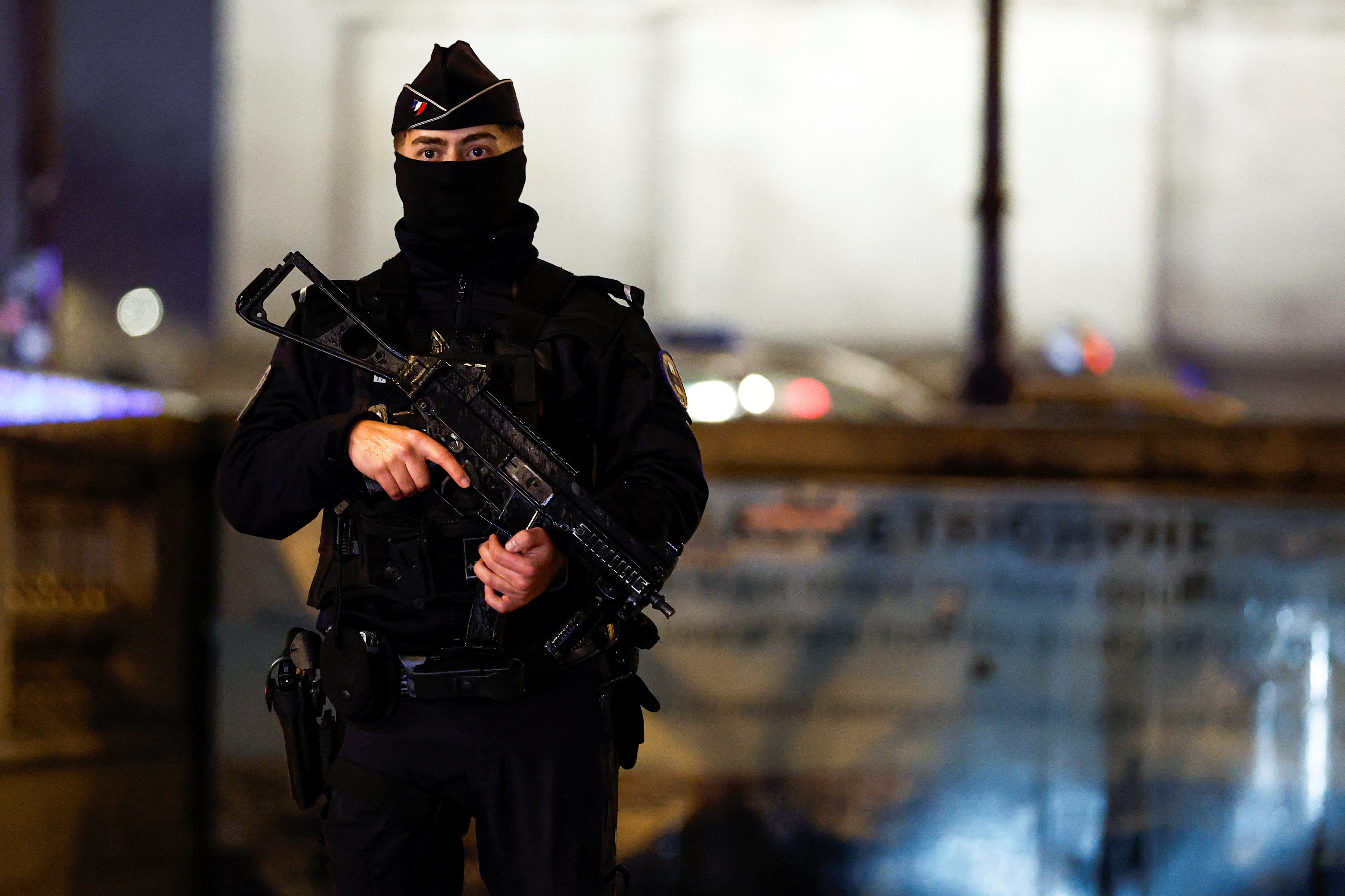 cover Paris police fire on a man who attacked them with a knife near Arc de Triomphe