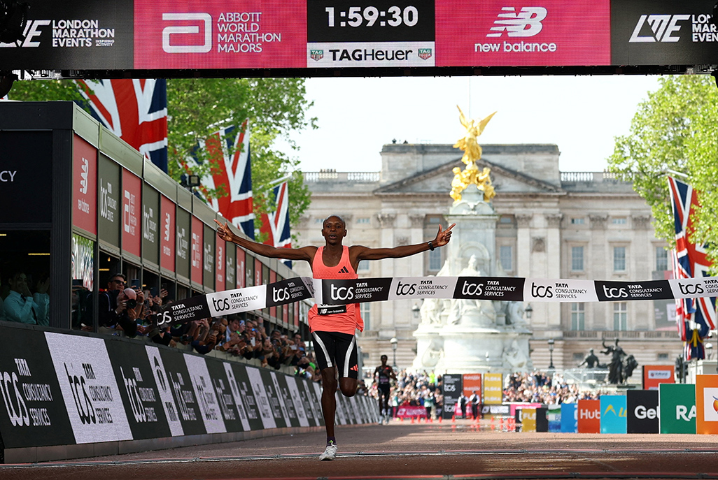 cover Sawe smashes two-hour barrier to make history in London