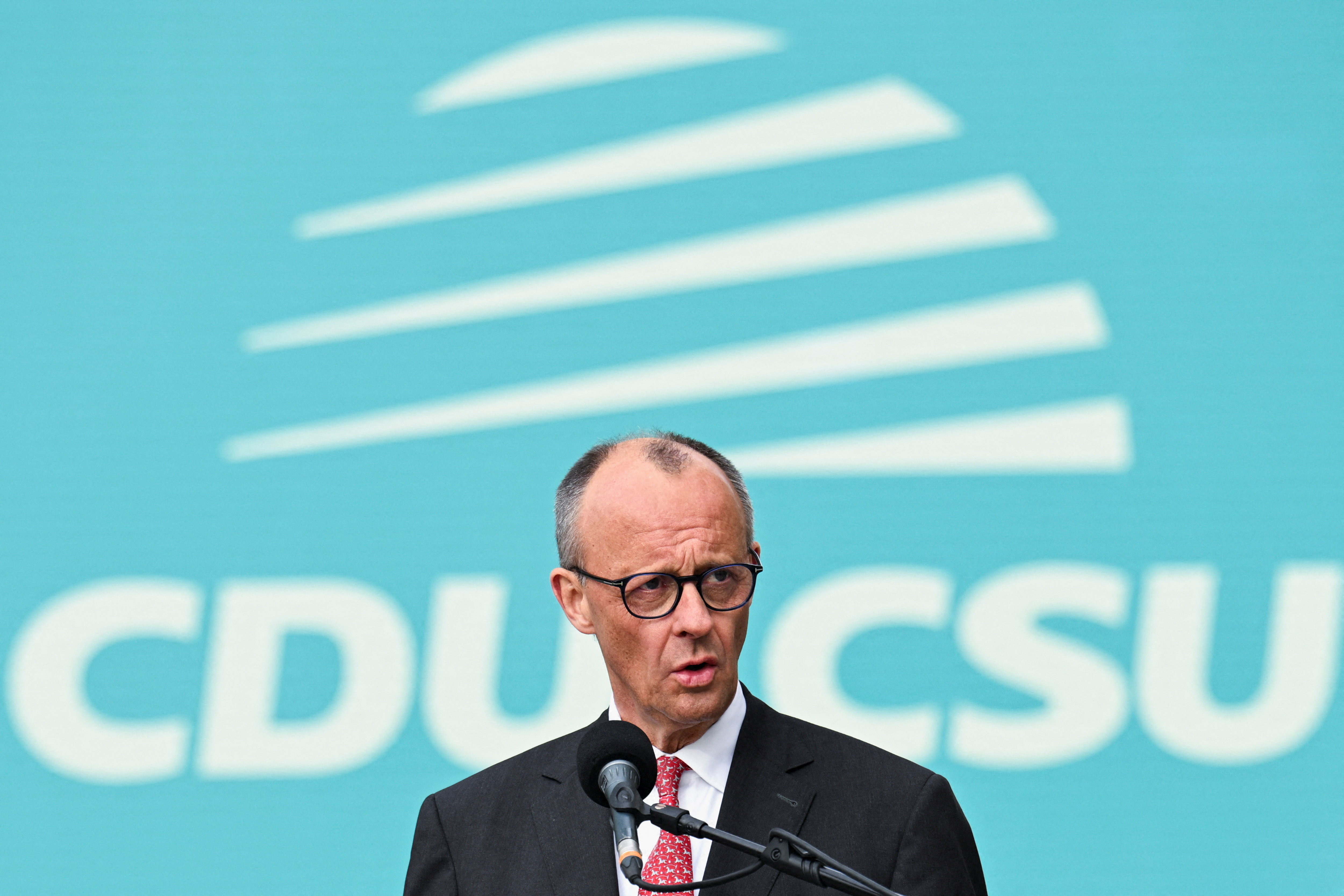 cover Trump hits back at German chancellor after Iran criticism