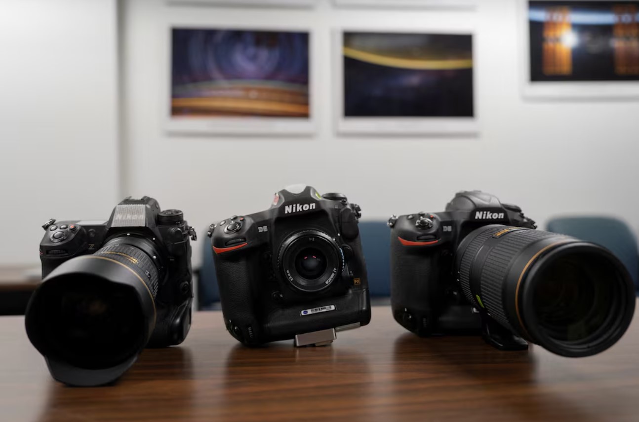 Models of the Nikon camera equipment the NASA Artemis II crew took to space are shown to Reuters during an interview with Paul Reichart and Kristina Willoughby, the photography trainers who trained the astronauts, at the NASA Lyndon B. Johnson Space Centre in Houston, Texas, U.S., April 14, 2026. The cameras include the Nikon Z9 mirrorless camera and two Nikon D5 DSLRs. REUTERS/Danielle Villasana