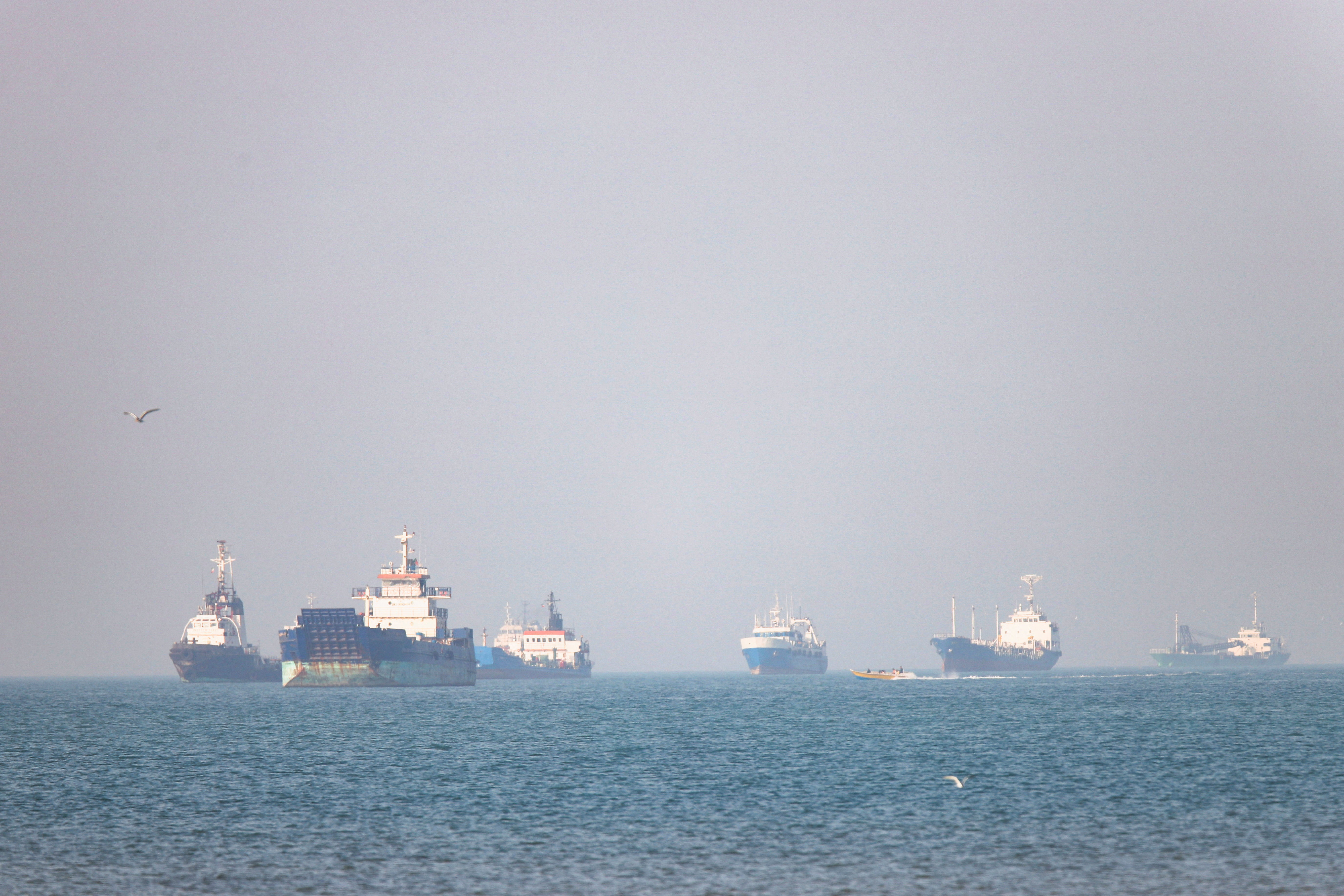 image US strikes six Iranian military boats, Iran hits UAE oil facility