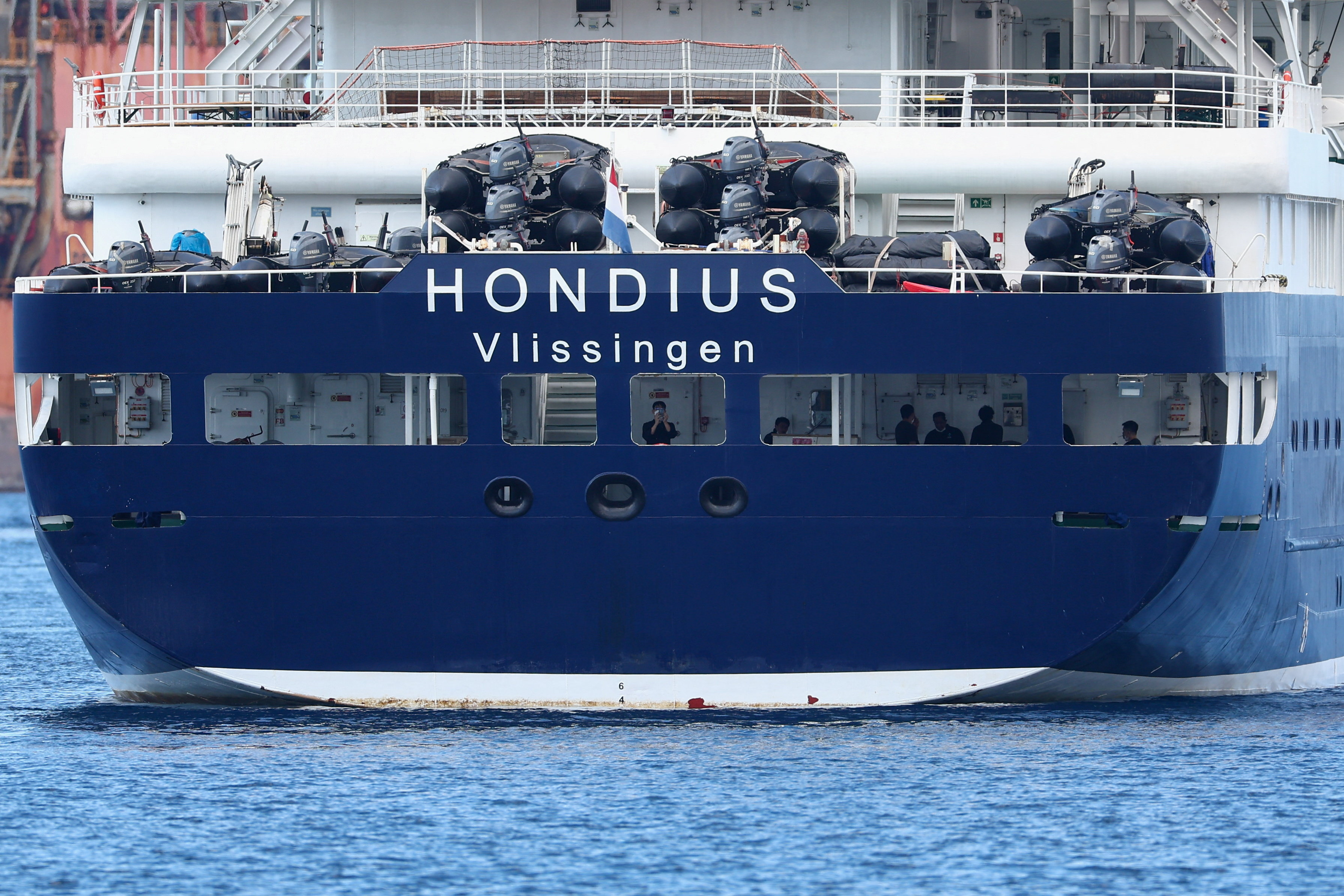 cover Two test positive as evacuation of virus-hit cruise ship nears completion