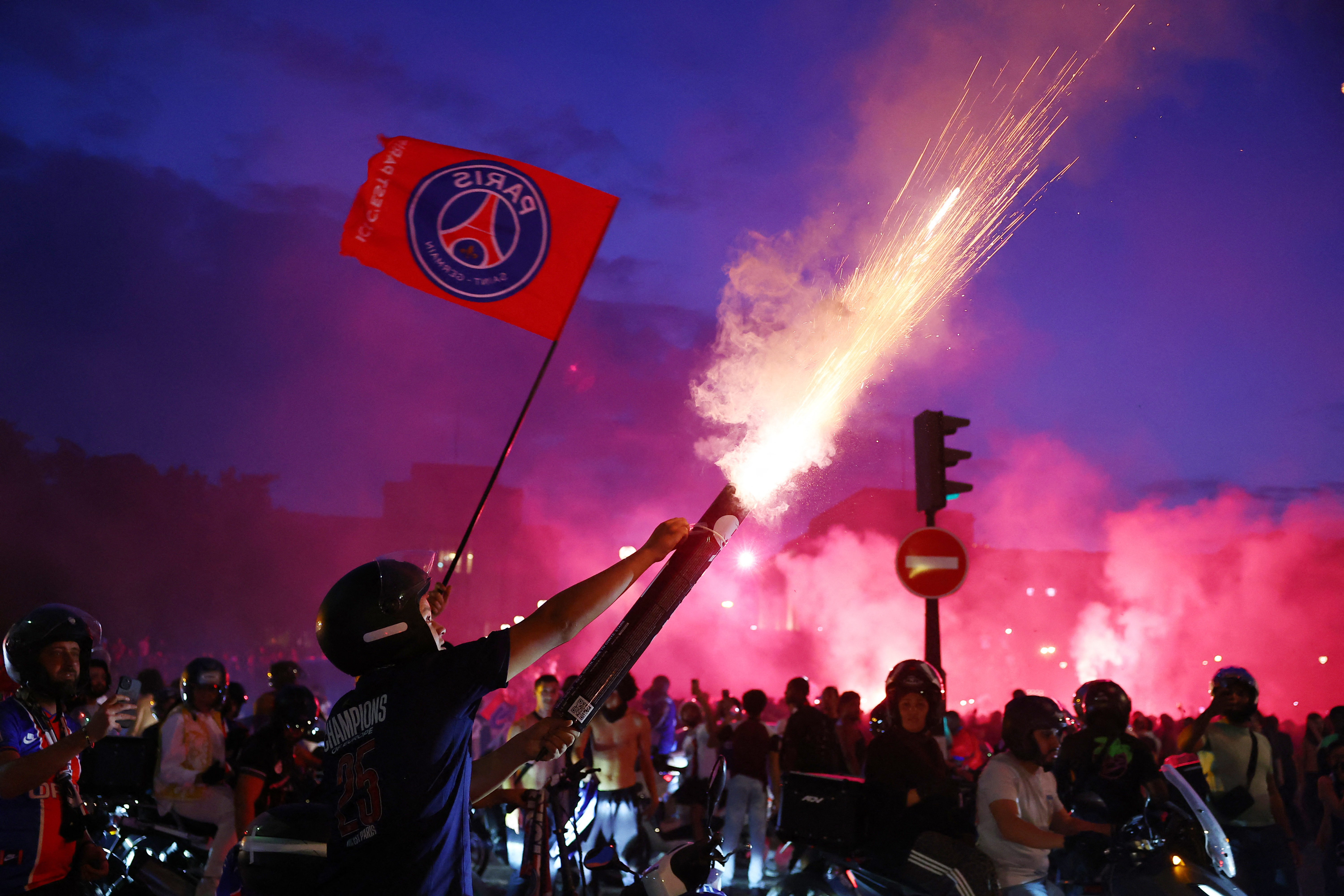 cover Two hundred hurt in post-game violence as Paris hails second Champions League triumph