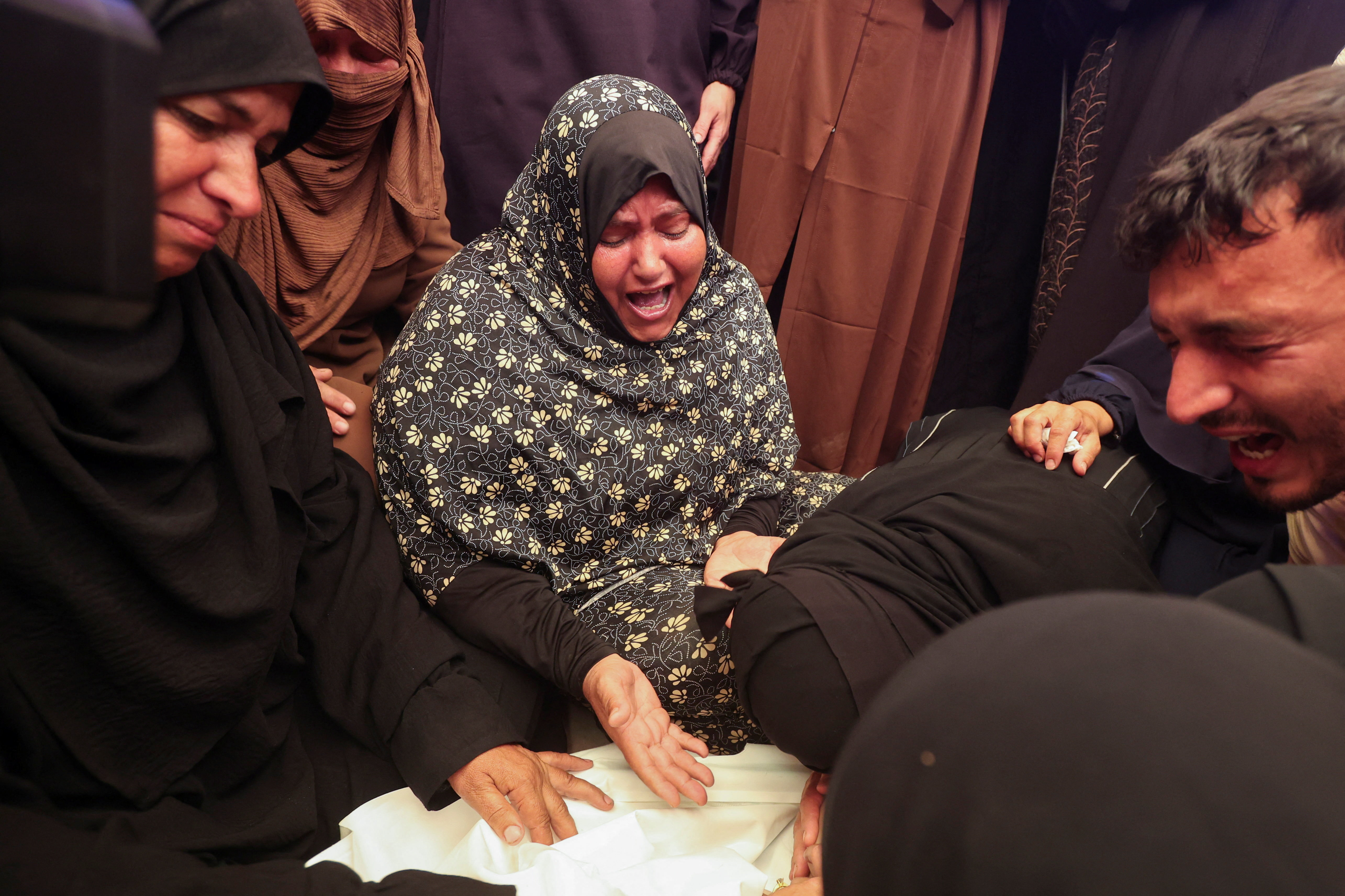cover Israeli fire kills six-year-old girl and a woman in Gaza, medics say