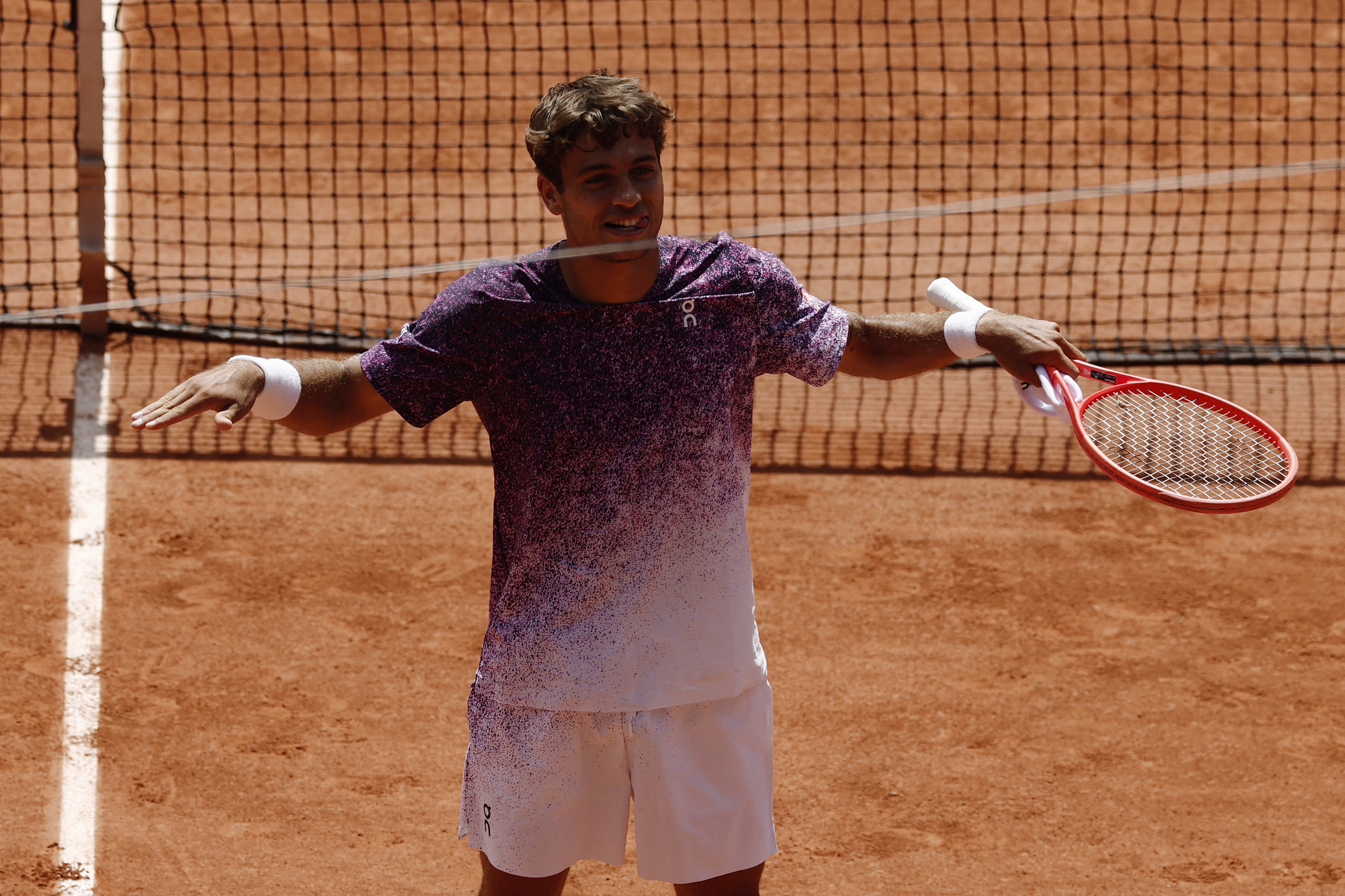 image Cobolli drops set but battles past unseeded Svajda to reach French Open last eight