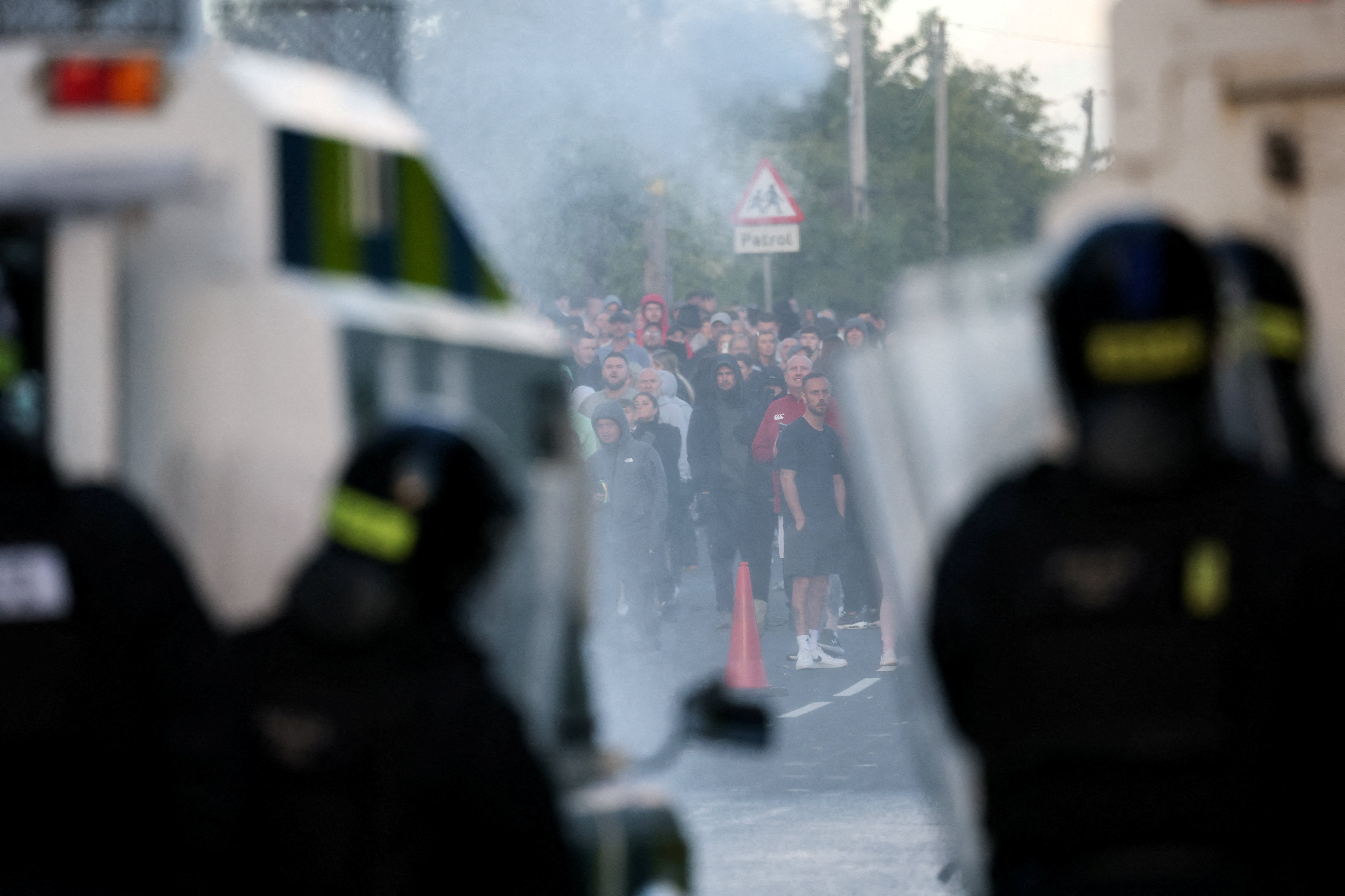 cover UK minister says violence in Northern Ireland is racist thuggery