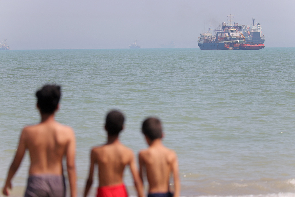 cover Iran insists on right to control shipping in Strait of Hormuz after ship hit near Oman