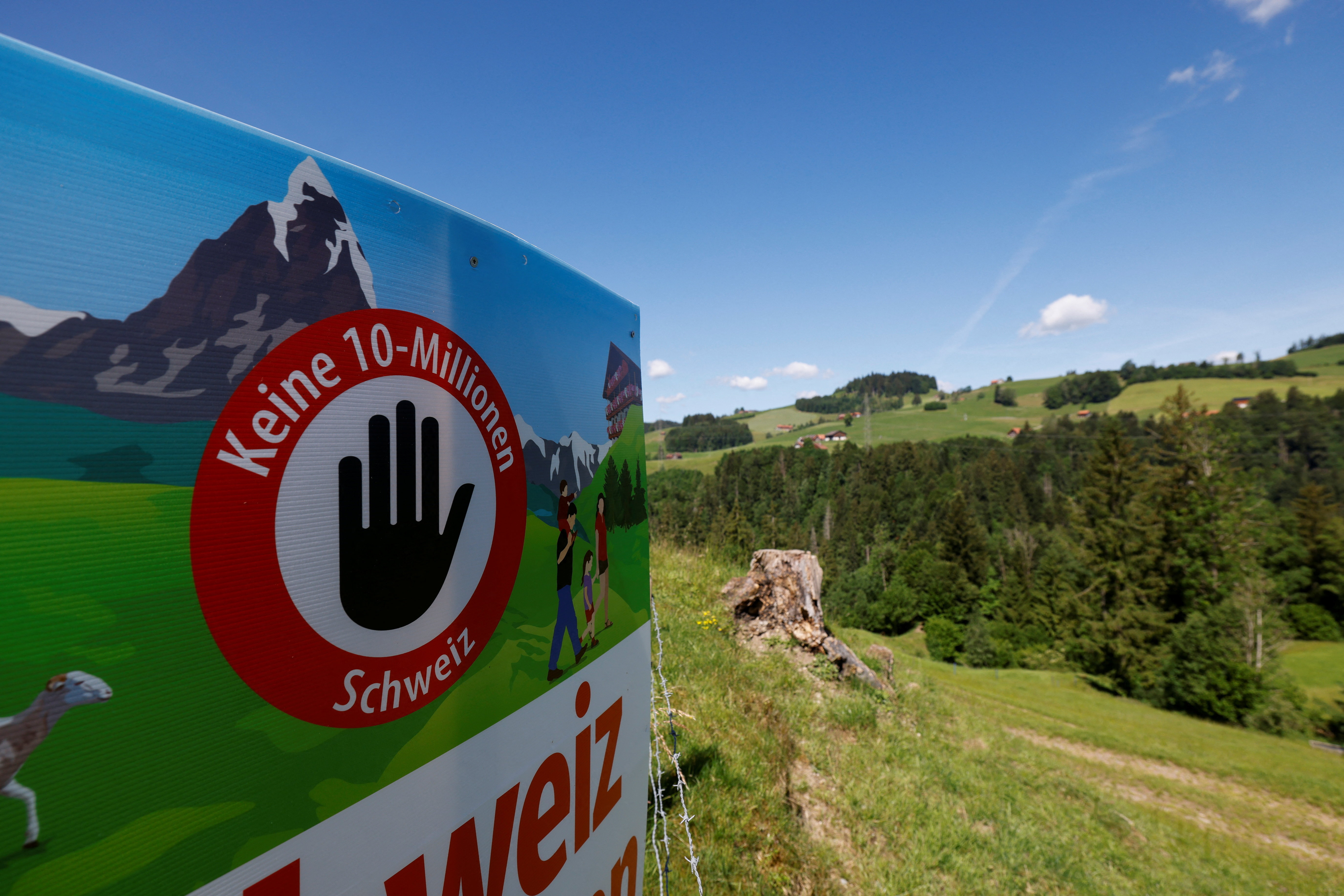 cover Swiss reject population cap in referendum