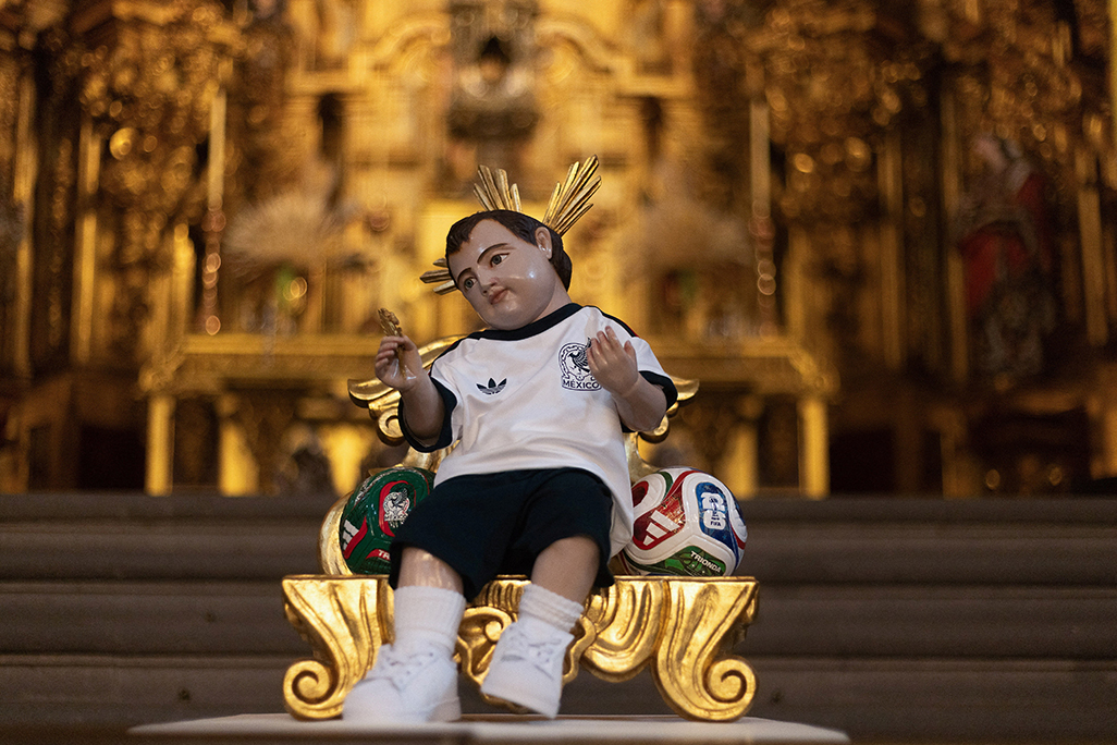 cover Praying for a World Cup miracle? Fans flock to baby Jesus in Mexico kit 