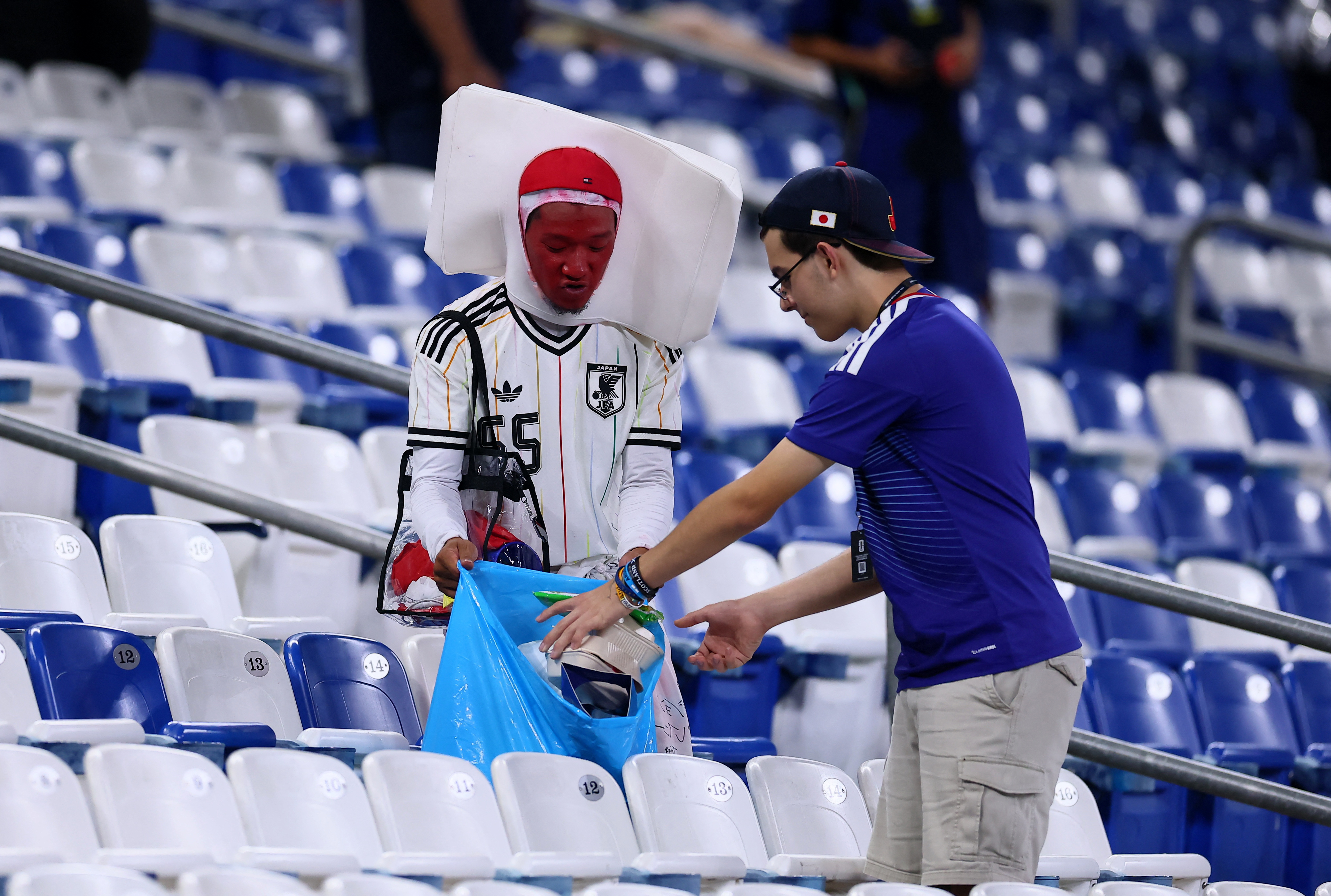 cover After Samurai Blue sweep aside Tunisia, Japan fans clean up Monterrey stadium
