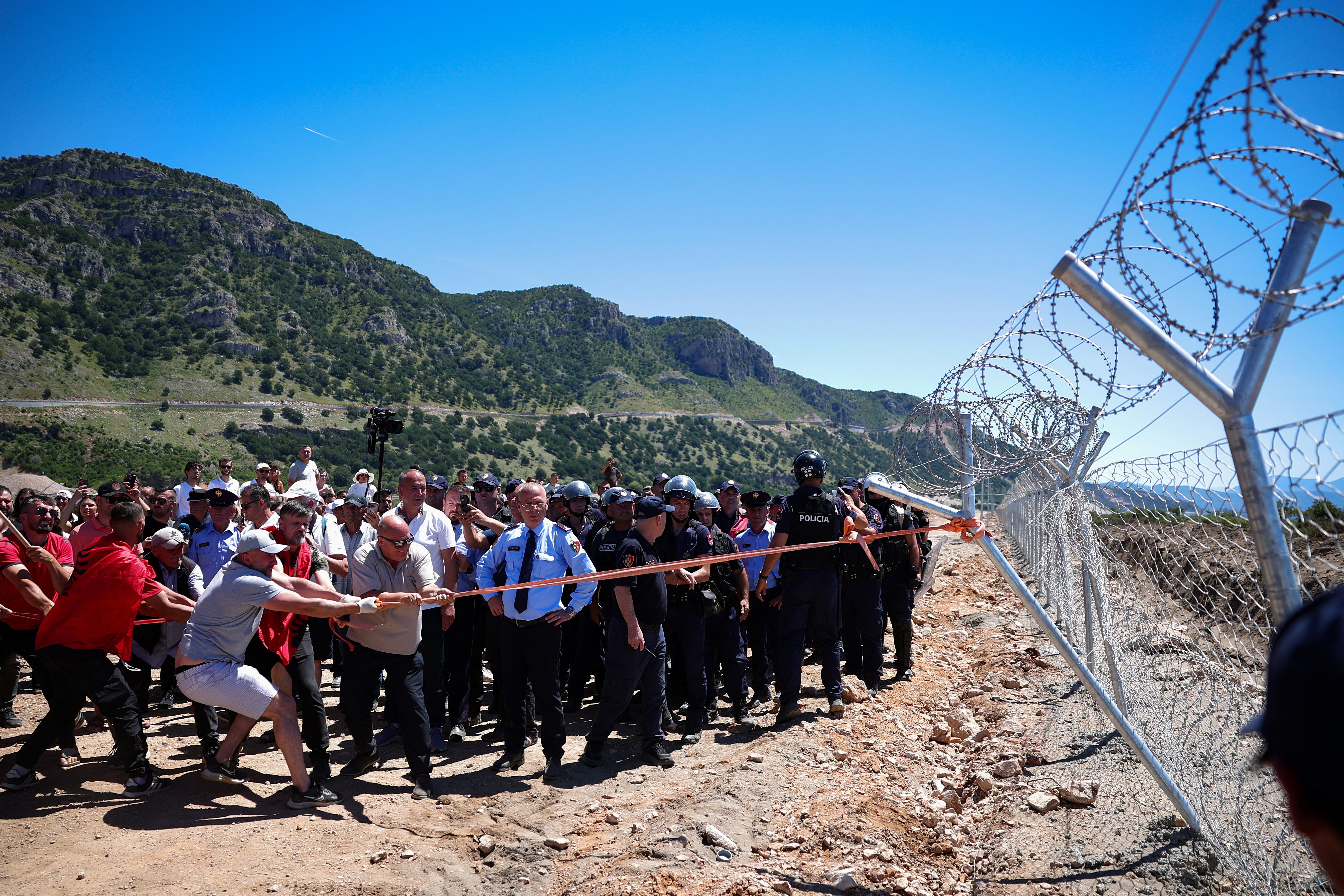 cover Protesters tear down Albanian development site fences, amid anger over coastal projects