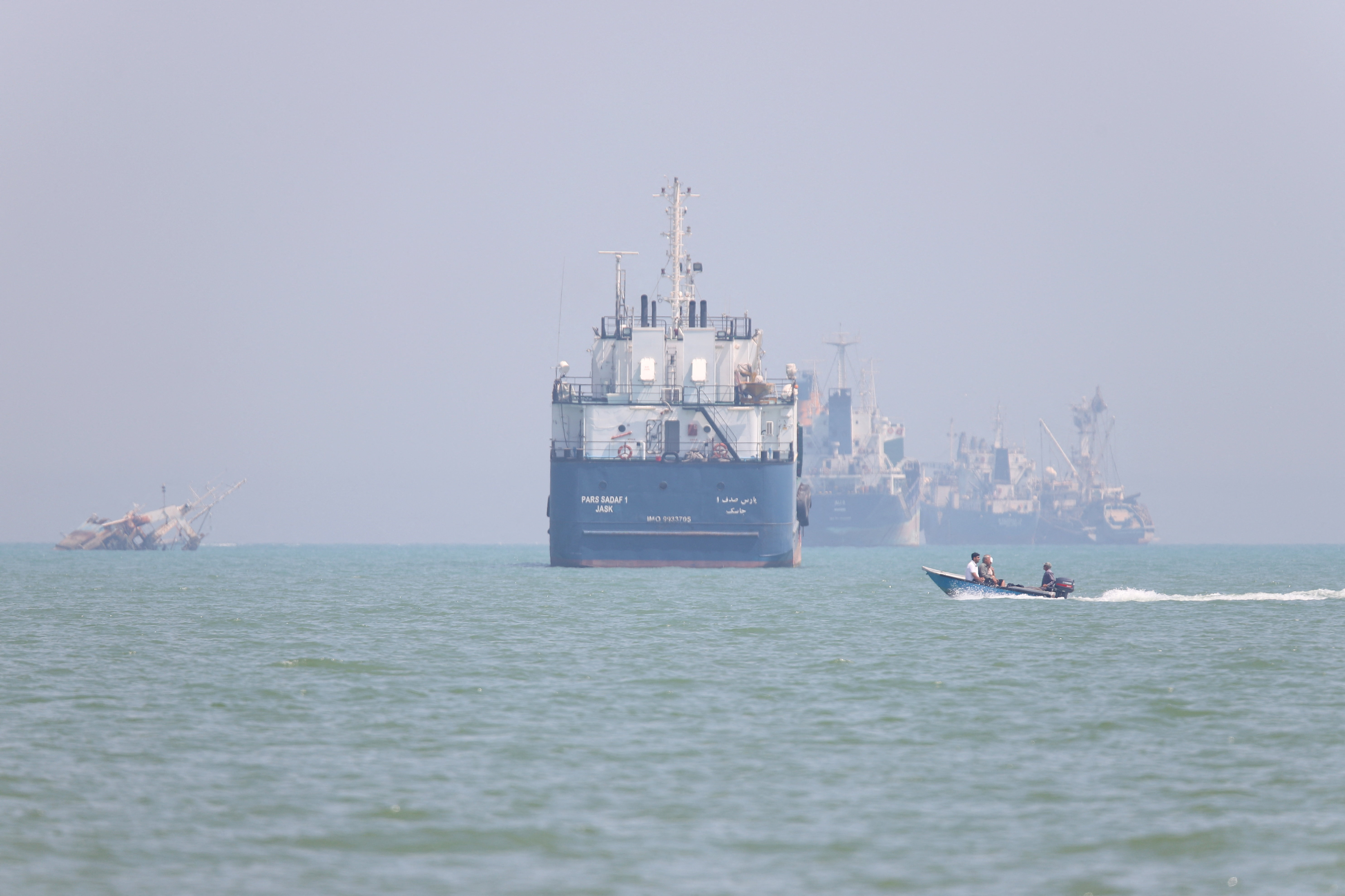 cover Iran peace deal looms while new military action flares near Strait of Hormuz