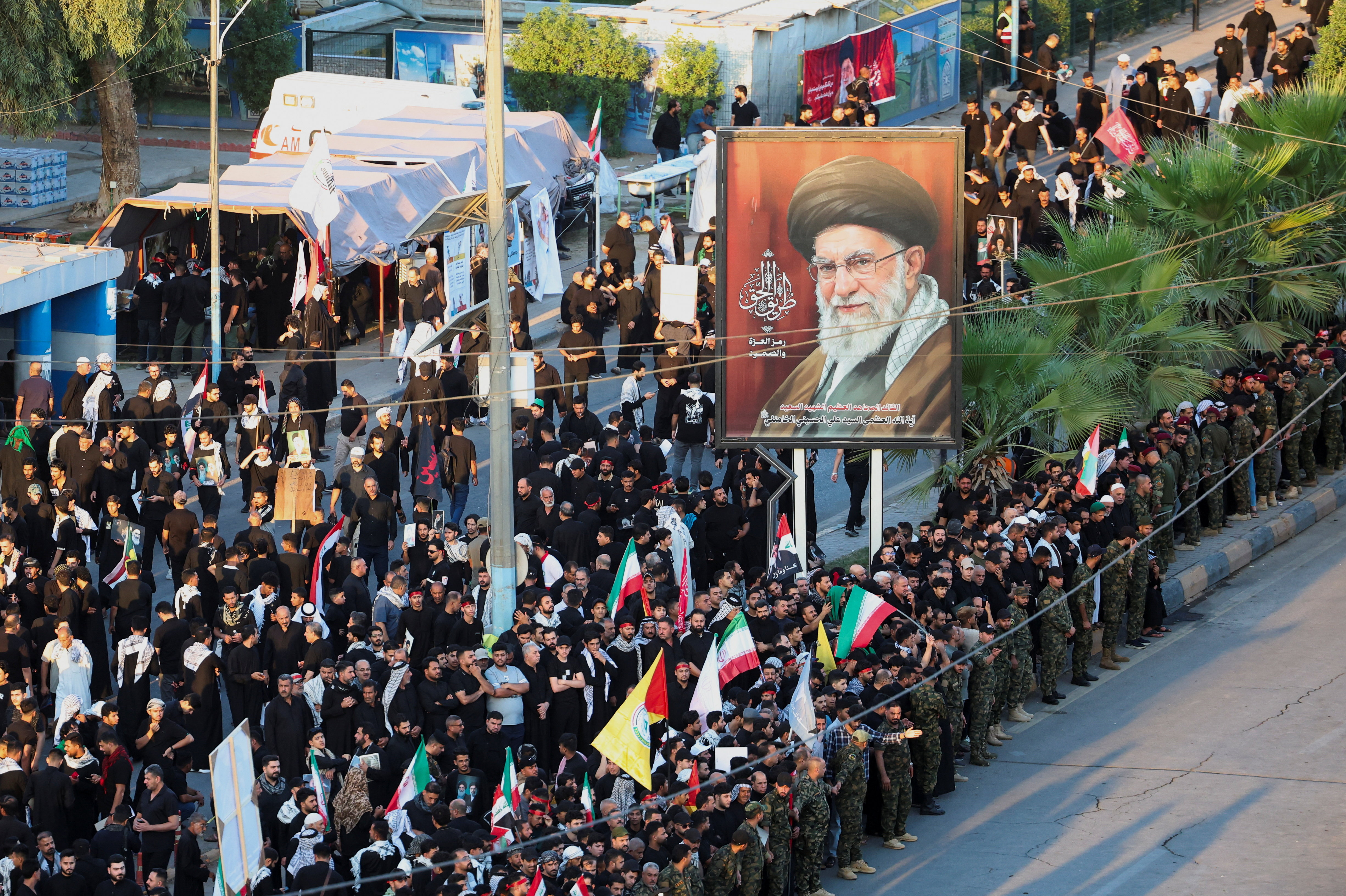 cover Thousands march as Khamenei&#8217;s funeral procession crosses into Iraq