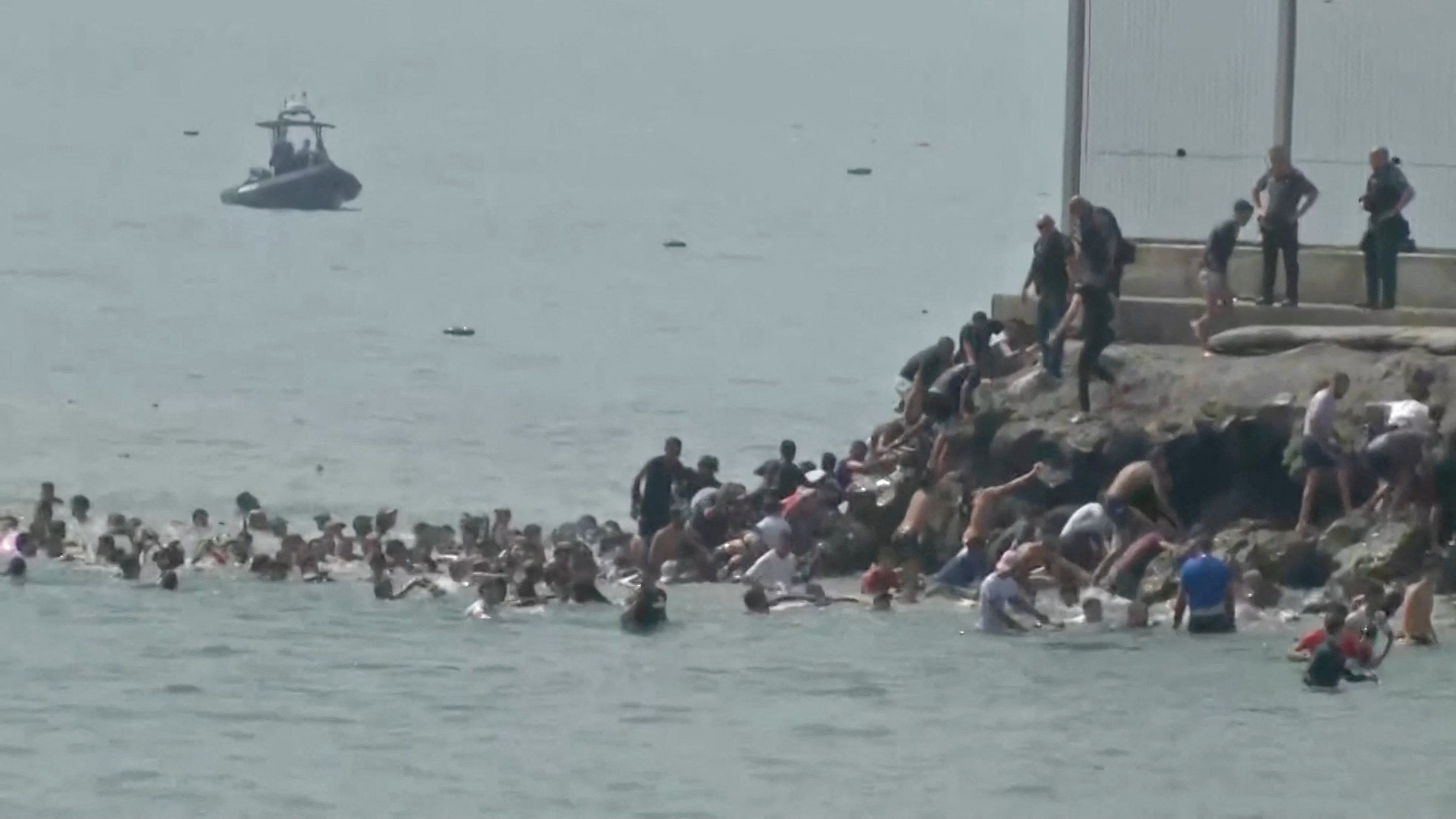 cover Migrants break through border into Spain&#8217;s Ceuta, military called in