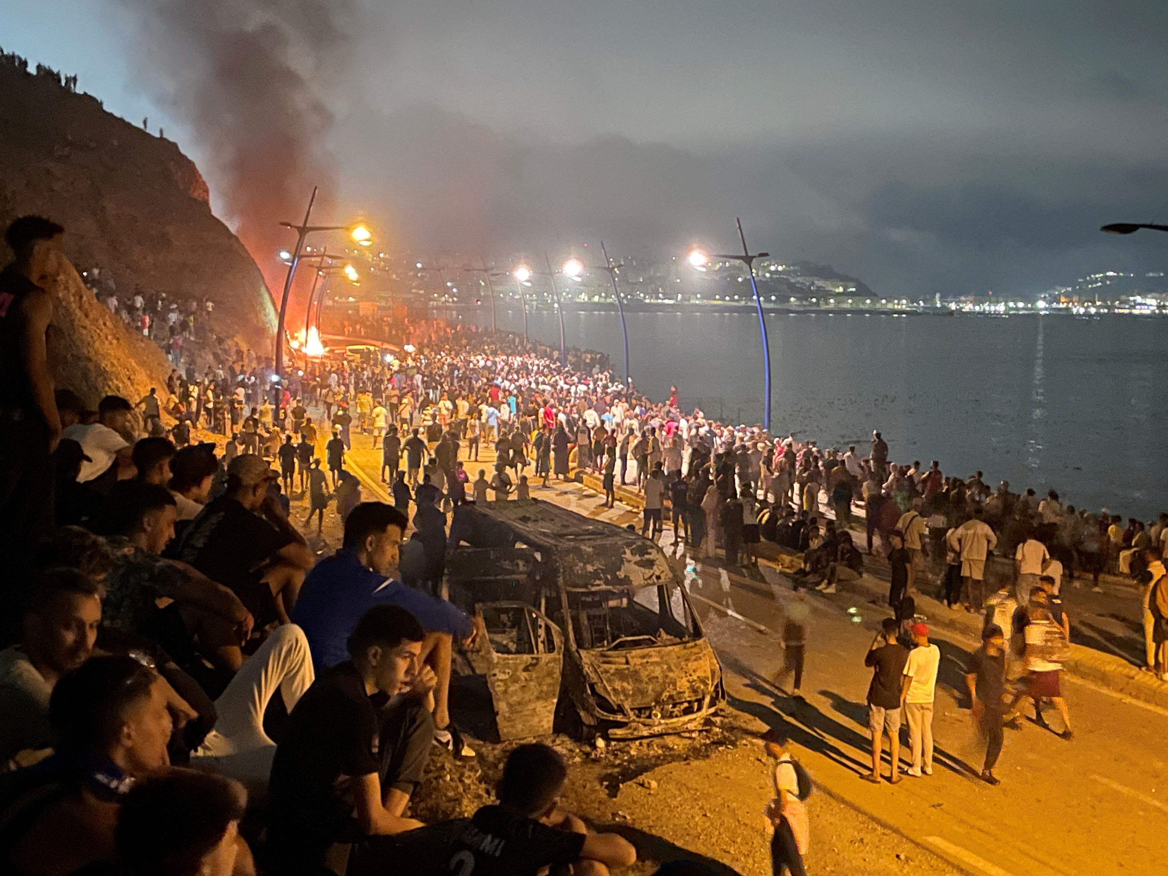 cover Migrant deaths rise to 18 in massive crossing into Spain&#8217;s Ceuta from Morocco