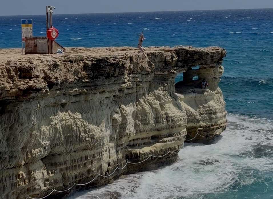 cover Despite a fence at Cape Greco, people just keep jumping