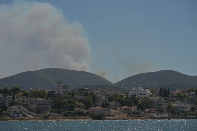 cover Two dead as fires rage across Salamina, residents evacuated by sea